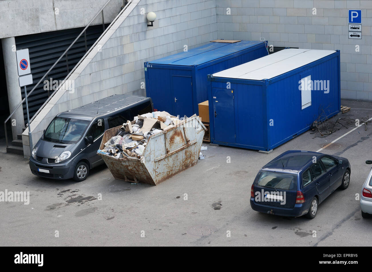 The container with construction garbage in the city hotel yard Stock