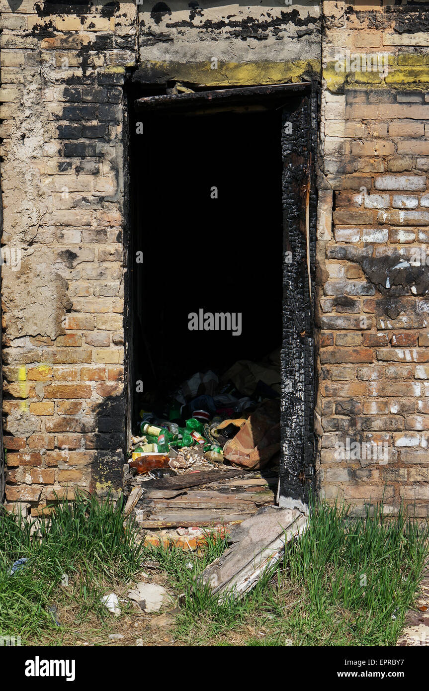 Doorway of the brick house which burned down on the fire. Sunny day