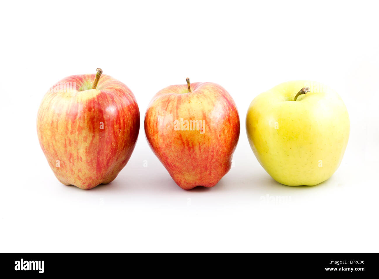 Two red delicious apples and one granny smith Stock Photo Alamy