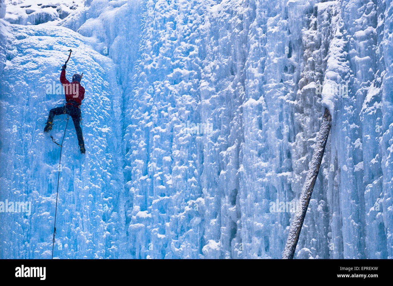 A lead ice climber reaches the top of a climb in Kootenay National Park