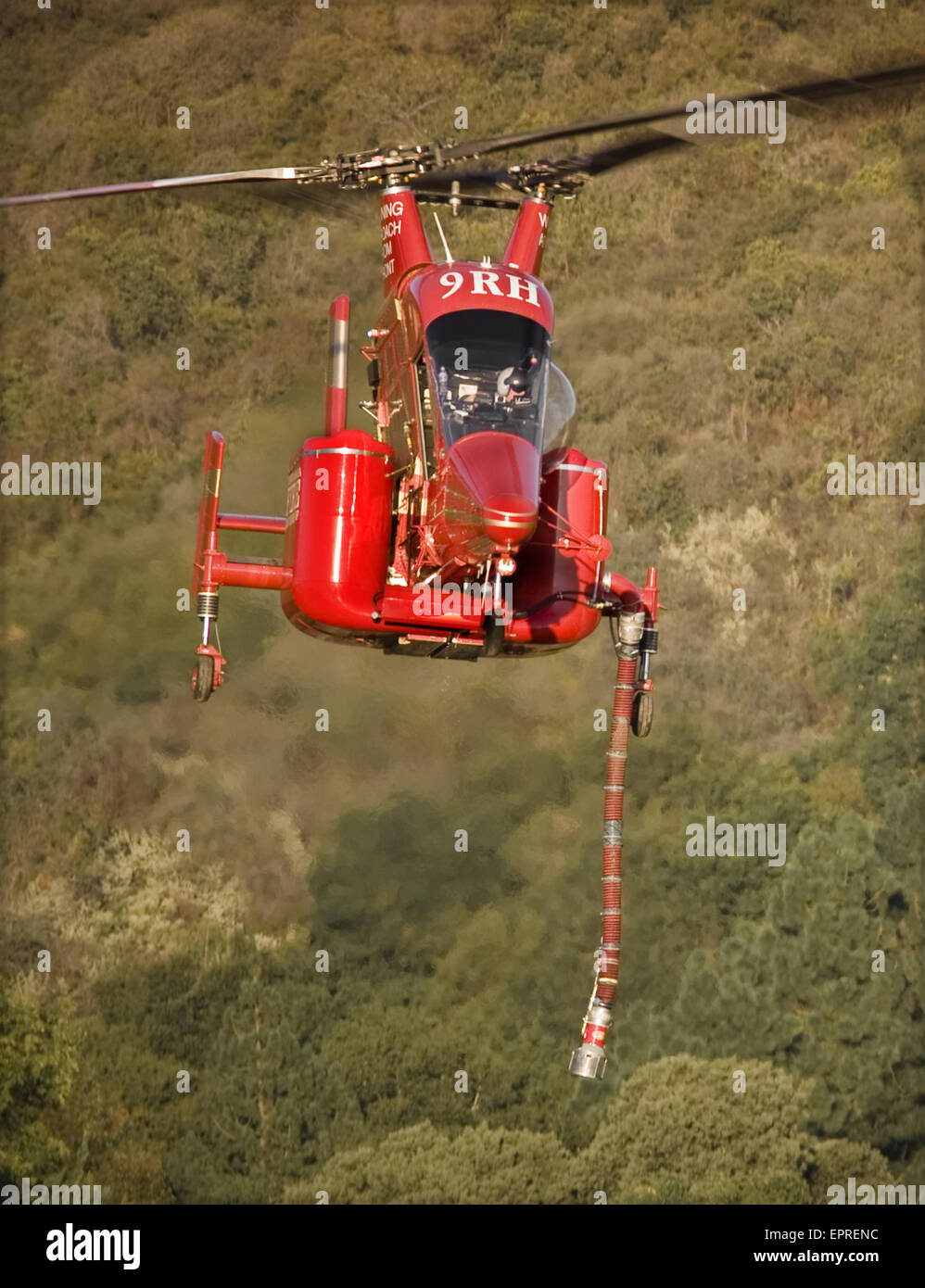 Helicopters pick up water from a reservoir while fighting wildfires in California Stock Photo