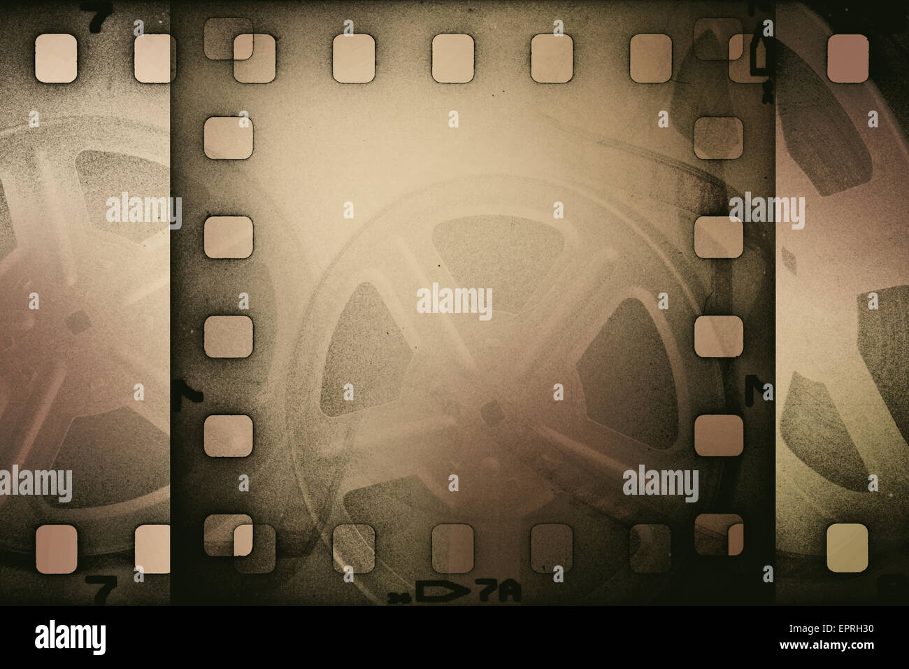 Grunge old motion picture reel with film strip. Vintage background. Stock Photo