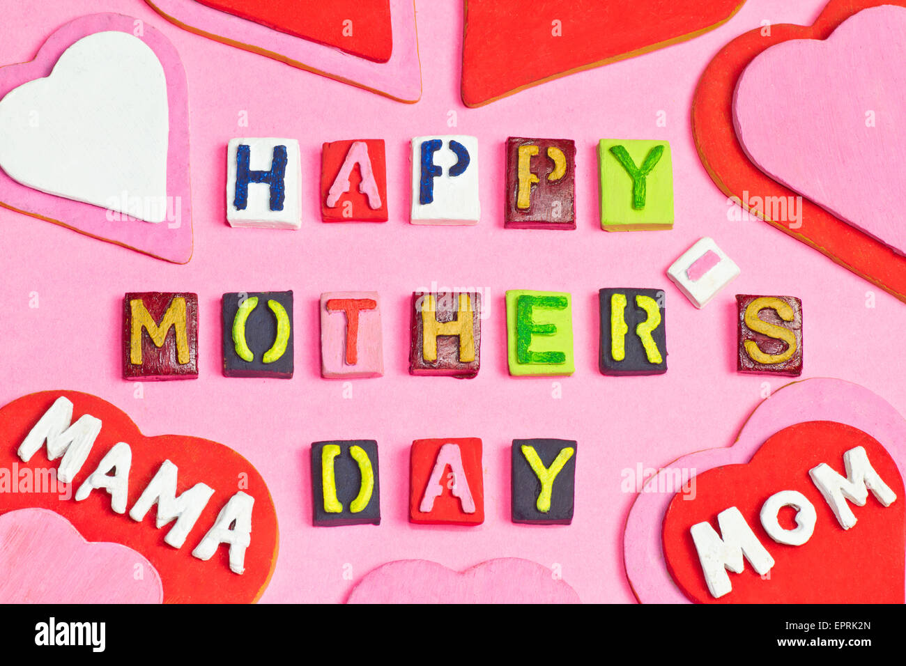 Happy Mother's day words and hearts on pink background Stock Photo - Alamy
