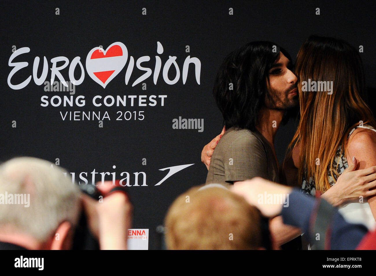 Vienna, Austria. 21st May, 2015. Last year winner Conchita Wurst (L) hugs the host while attending a press conference of the 60th Eurovision Song Contest (ESC) in Vienna, Austria, on May 21, 2015. © Qian Yi/Xinhua/Alamy Live News Stock Photo