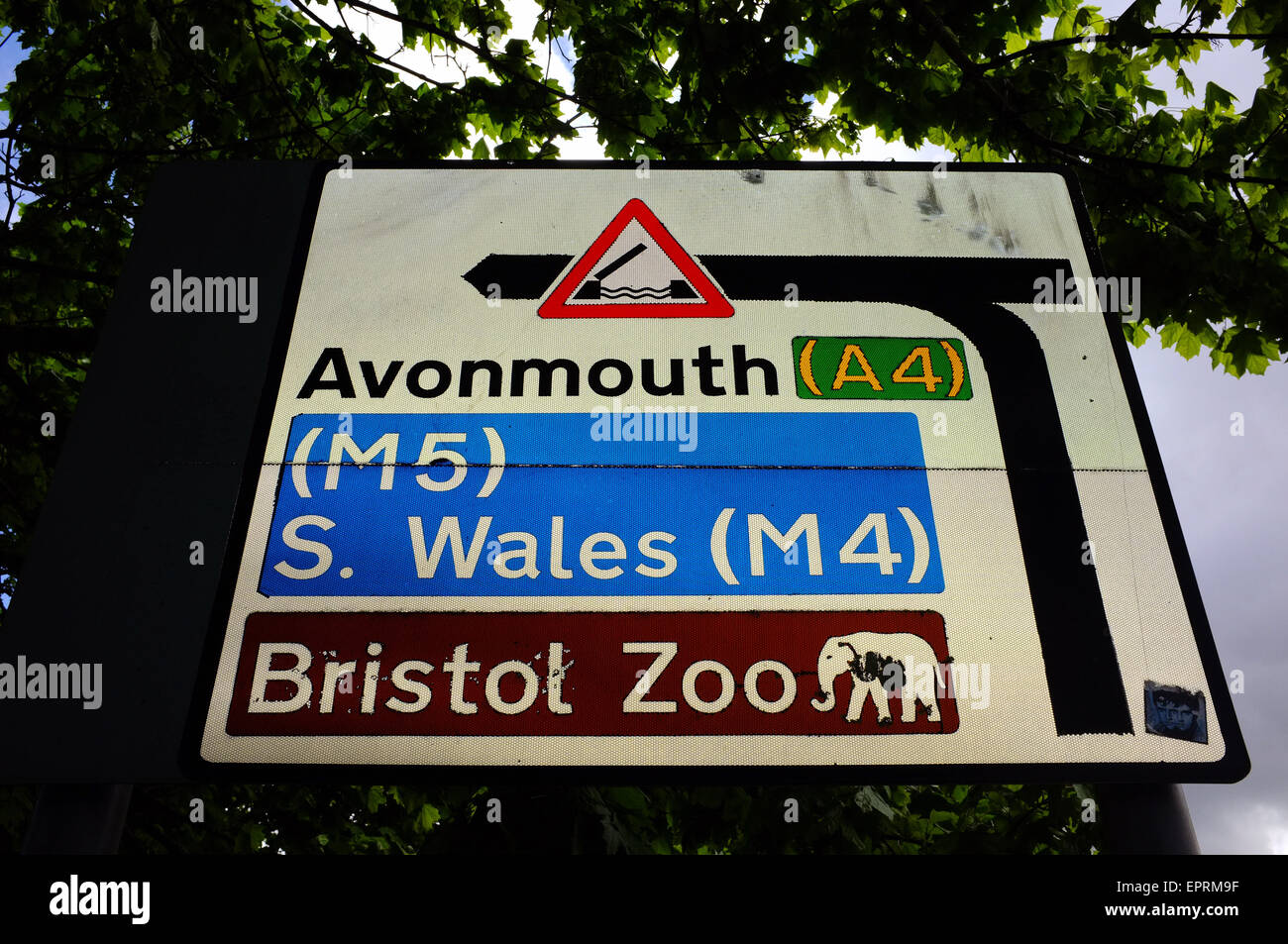 A roadsigns directing traffic to Avonmouth, South Wales and Bristol Zoo. Stock Photo