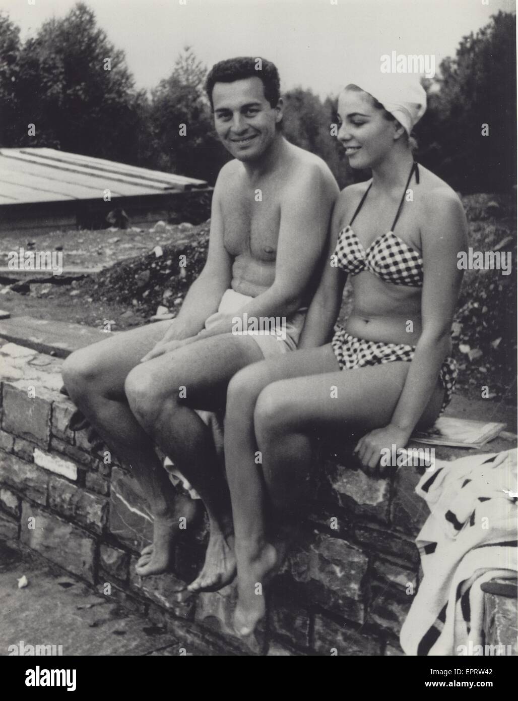 JOAN COLLINS with Sydney Chaplin, son of Charlie Chaplin at his father's  residence near Vevey in