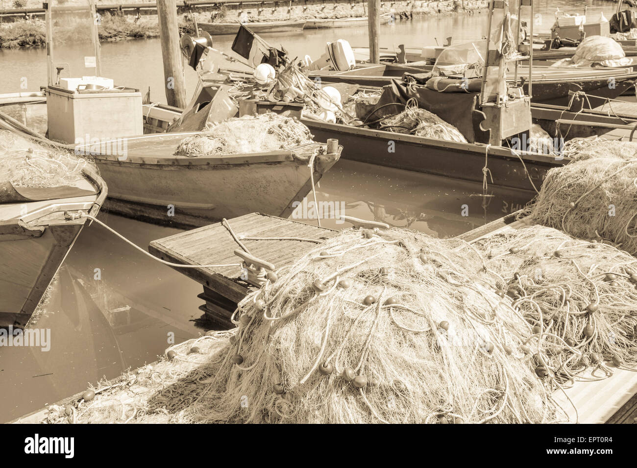 Effect vintage Fishing nets on the quay, in the background the fishing