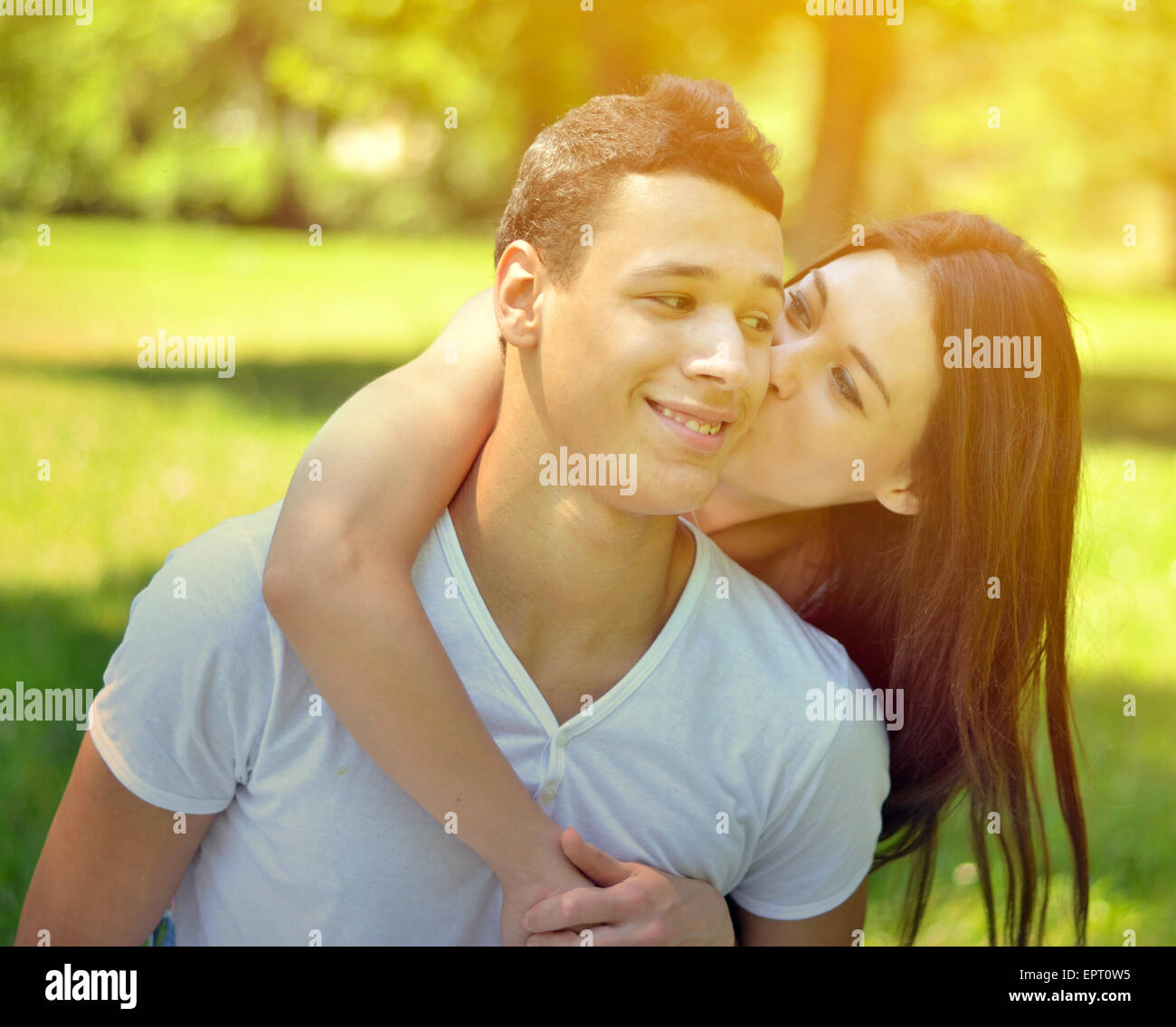 Couple hugging in park Stock Photo - Alamy