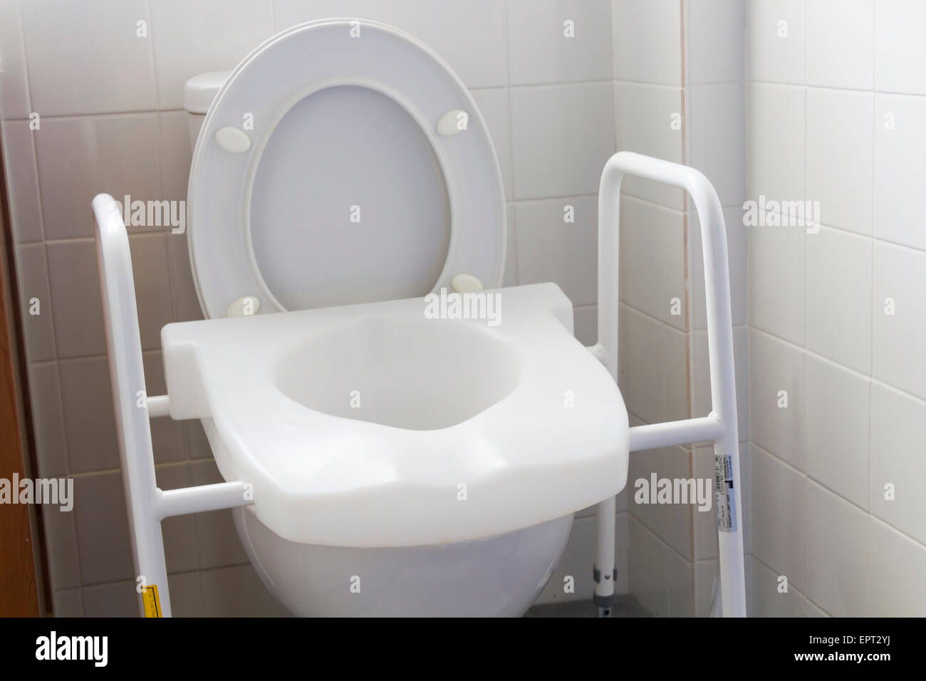 Raised toilet seat and frame for use by people with disabilities Stock