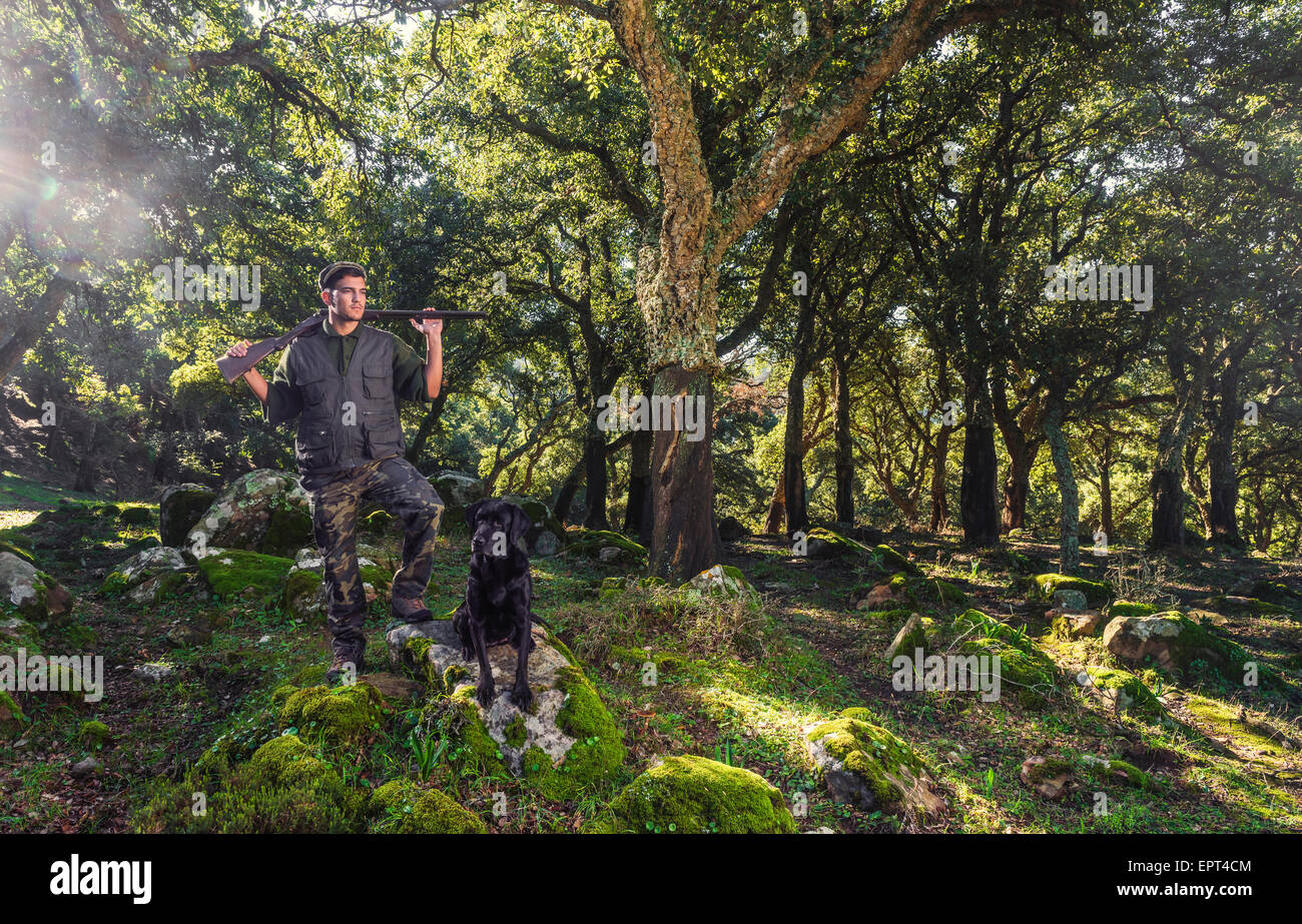 Hunter and pet dog in the forest. La Ahumada, Tarifa, Cadiz, Andalusia, Spain. Stock Photo