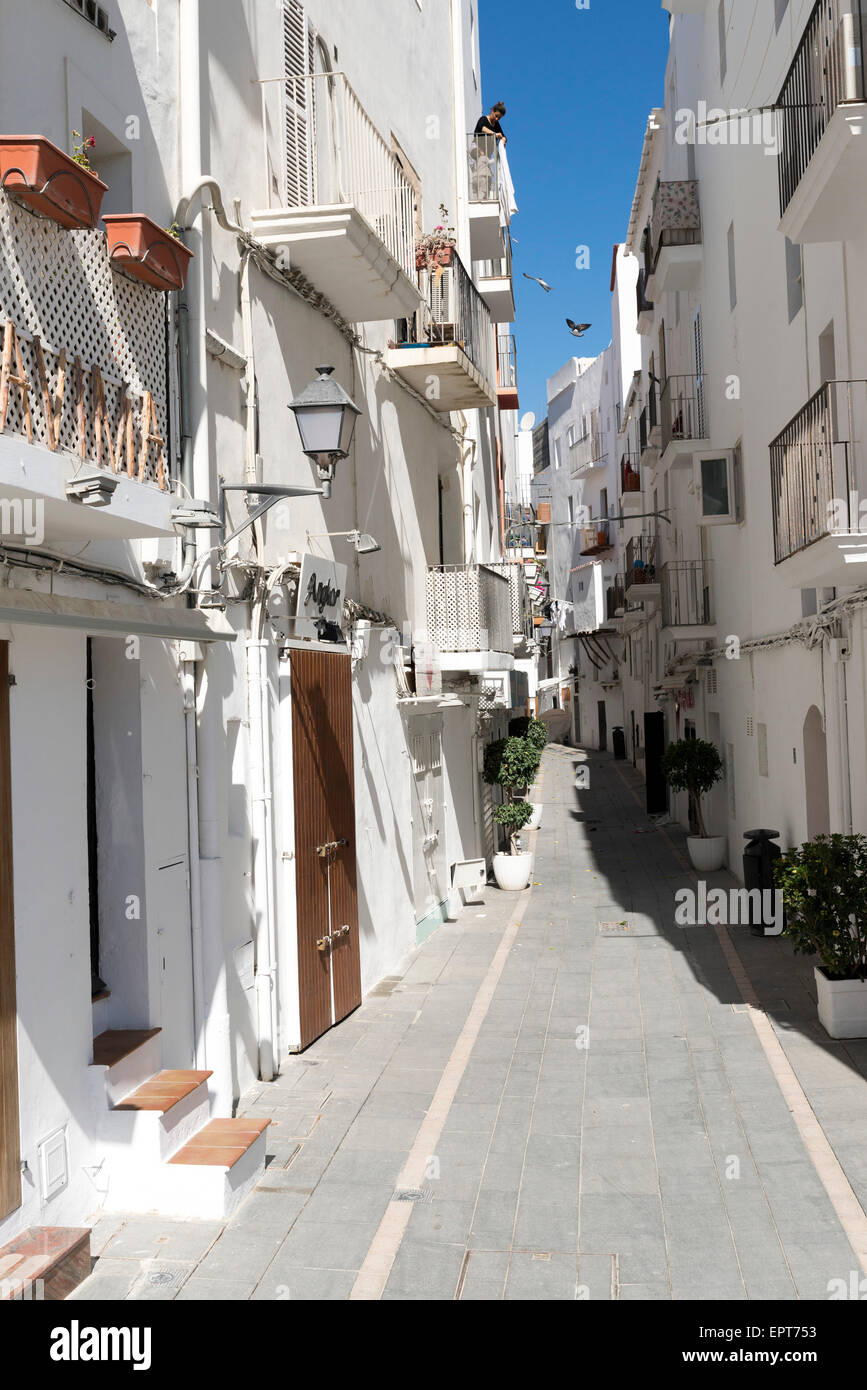 IBIZA, SPAIN - MAY 15, 2015: Ibiza downtown white houses narrow street in Mediterranean Spain Stock Photo