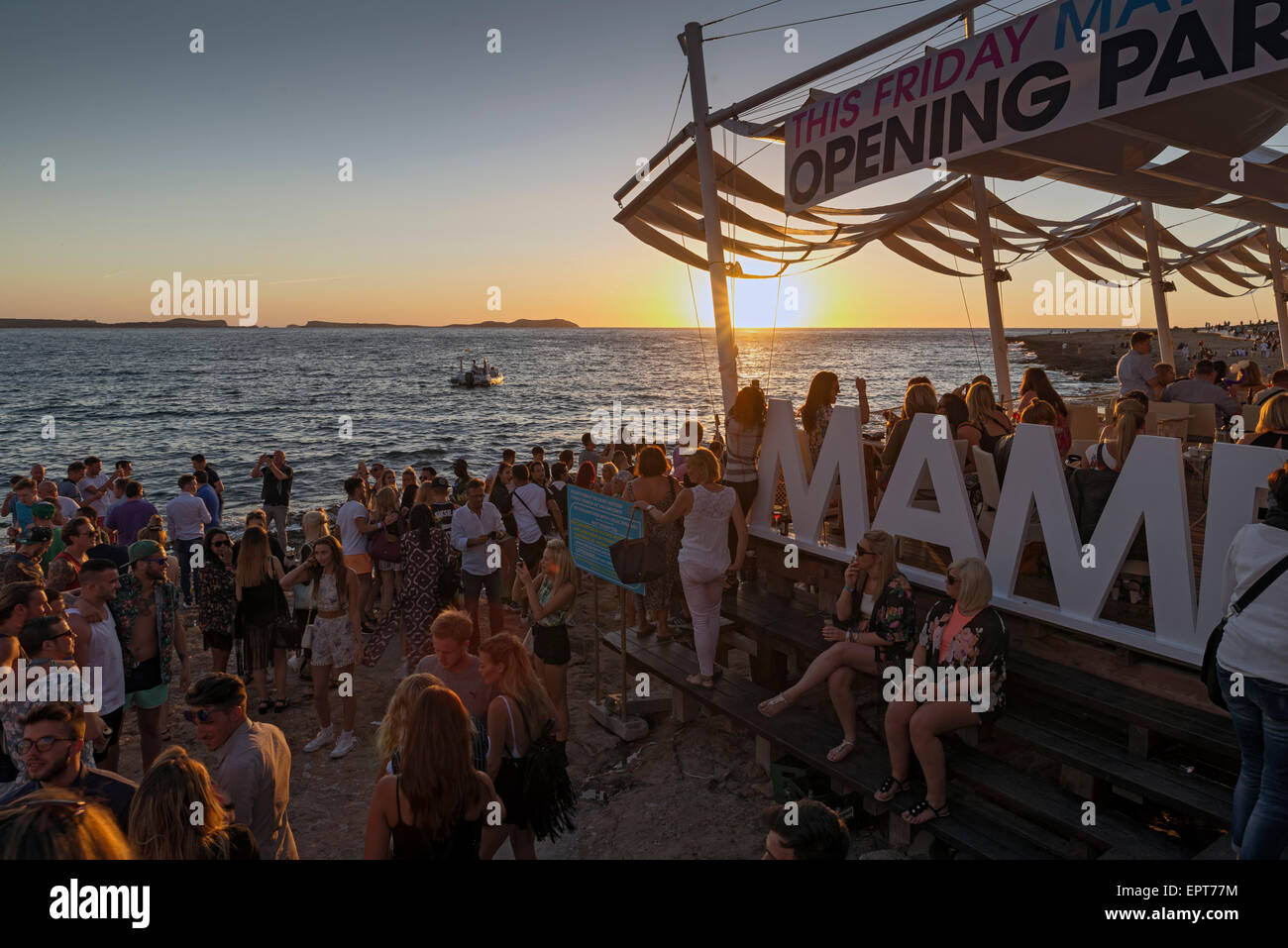 SAN ANTONI DE PORTMANY, IBIZA - MAY 15, 2015: People meet in bars coast to see the famous sunset and fun Stock Photo