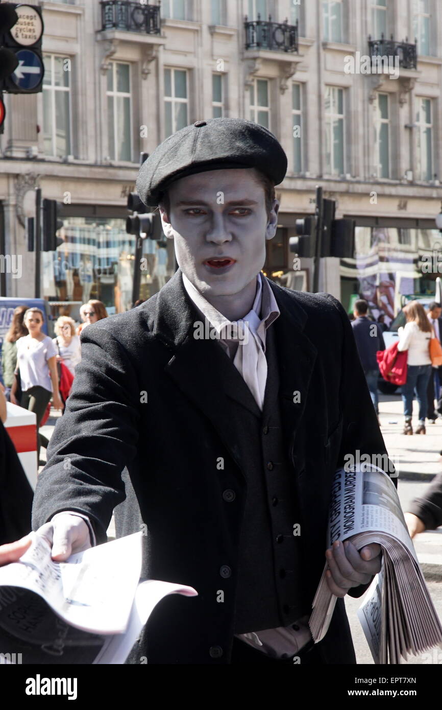 London UK. 21st May 2015. Couple of the Agatha Christie s ghost newspaper boys dressed in 1920s clothing at the Busiest Oxford Circus handing out specially made newspapers. To celebrate the launch of