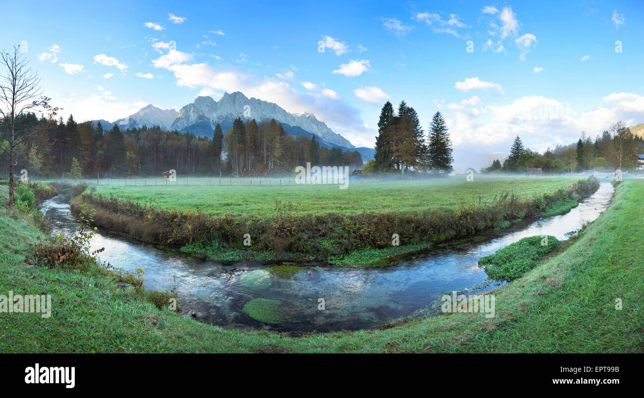 Landscape of Highest Mountain in Germany (Zugspitze) in the distance, on an early morning in autumn, view from Tirol, Austria Stock Photo