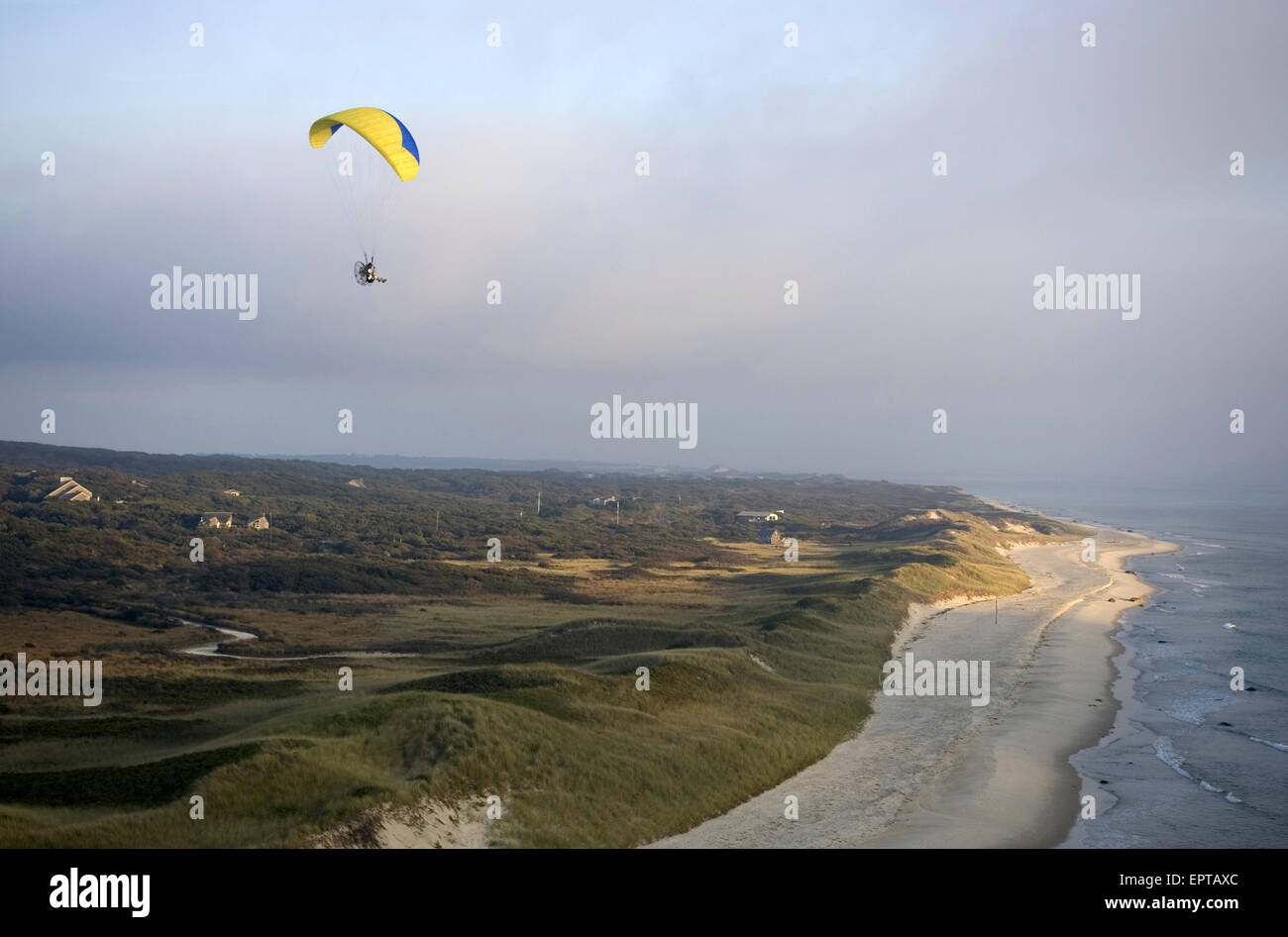 A powered Paraglider over the beach near Gay Head on Martha's Vineyard
