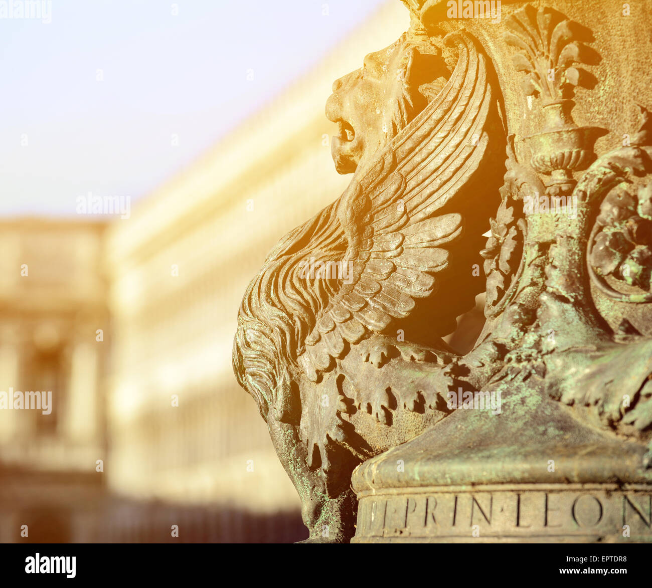 Winged lion statue architectural fragment from Venice. Detail of winged lion in flag mast on Piazza San Marco, Venice, Italy Stock Photo