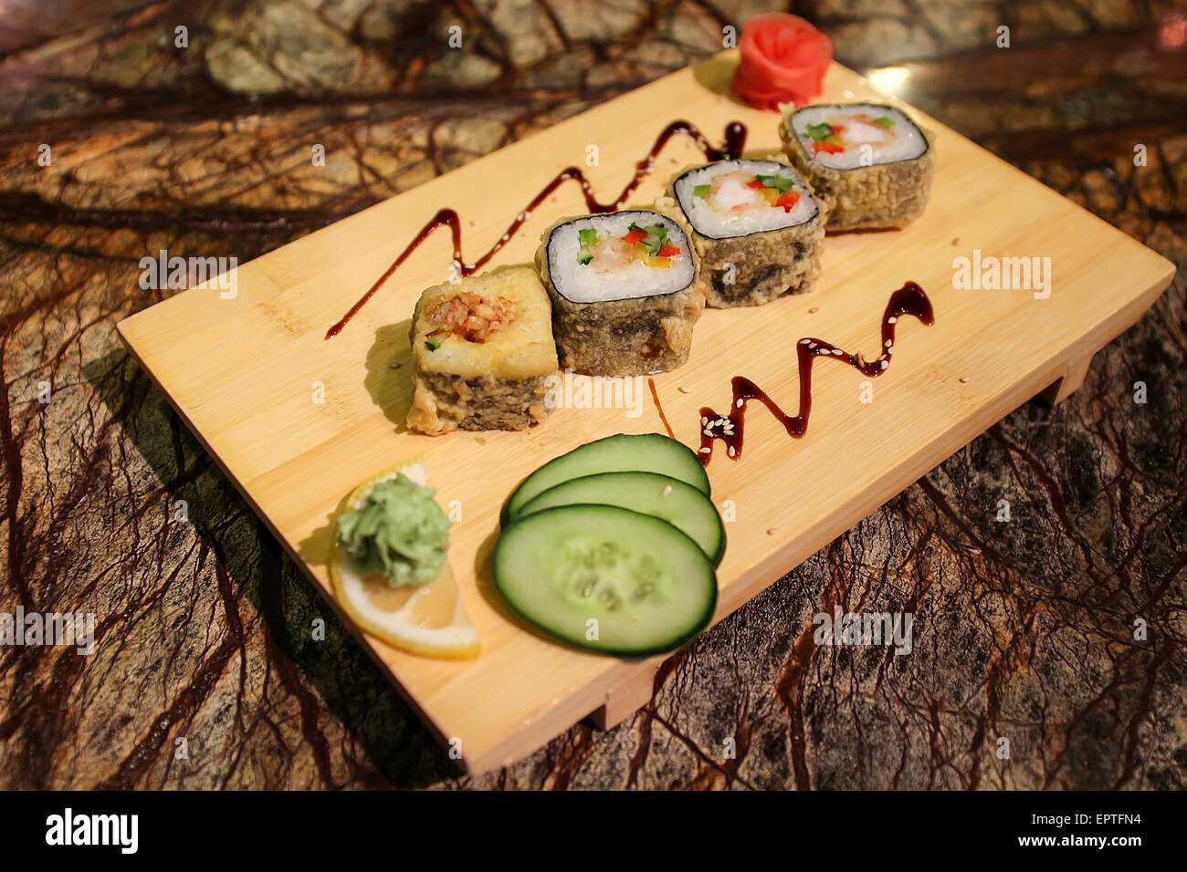 Delicious Magura grill maki sushi rolls served with a plate Stock Photo - Alamy
