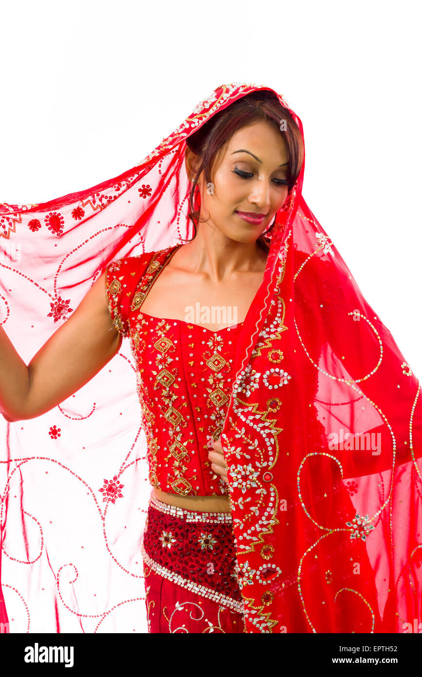Full Length Of Young Indian Woman Wearing A Red Saree And Smiling At The  Camera. Shot In The Studio, Isolated On White Background Stock Photo,  Picture and Royalty Free Image. Image 126899891.
