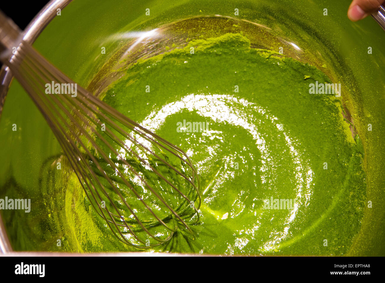 matcha ice cream making in a large bowl Stock Photo