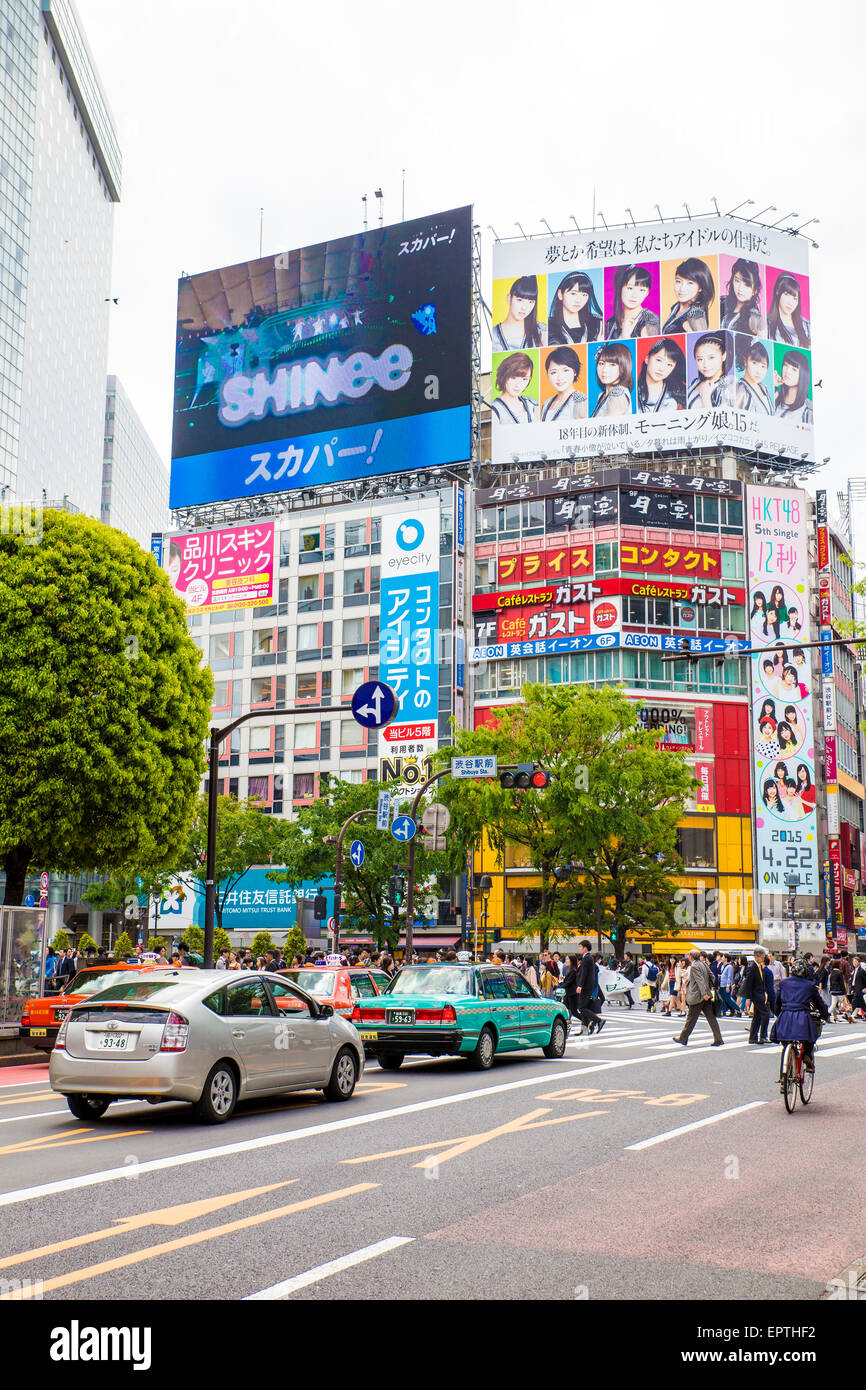 Street view of Tokyo Japan with people and neon signs and adverts Stock Photo