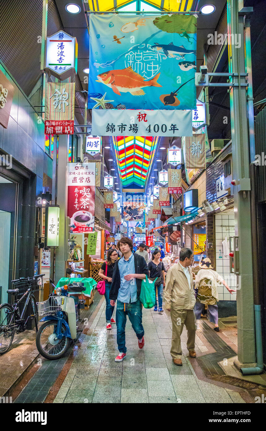 Street view of Tokyo Japan with people and neon signs and adverts Stock Photo