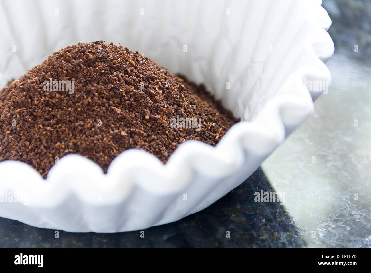 Fresh coffee grounds ready to be brewed for morning jolt of caffeine Stock Photo