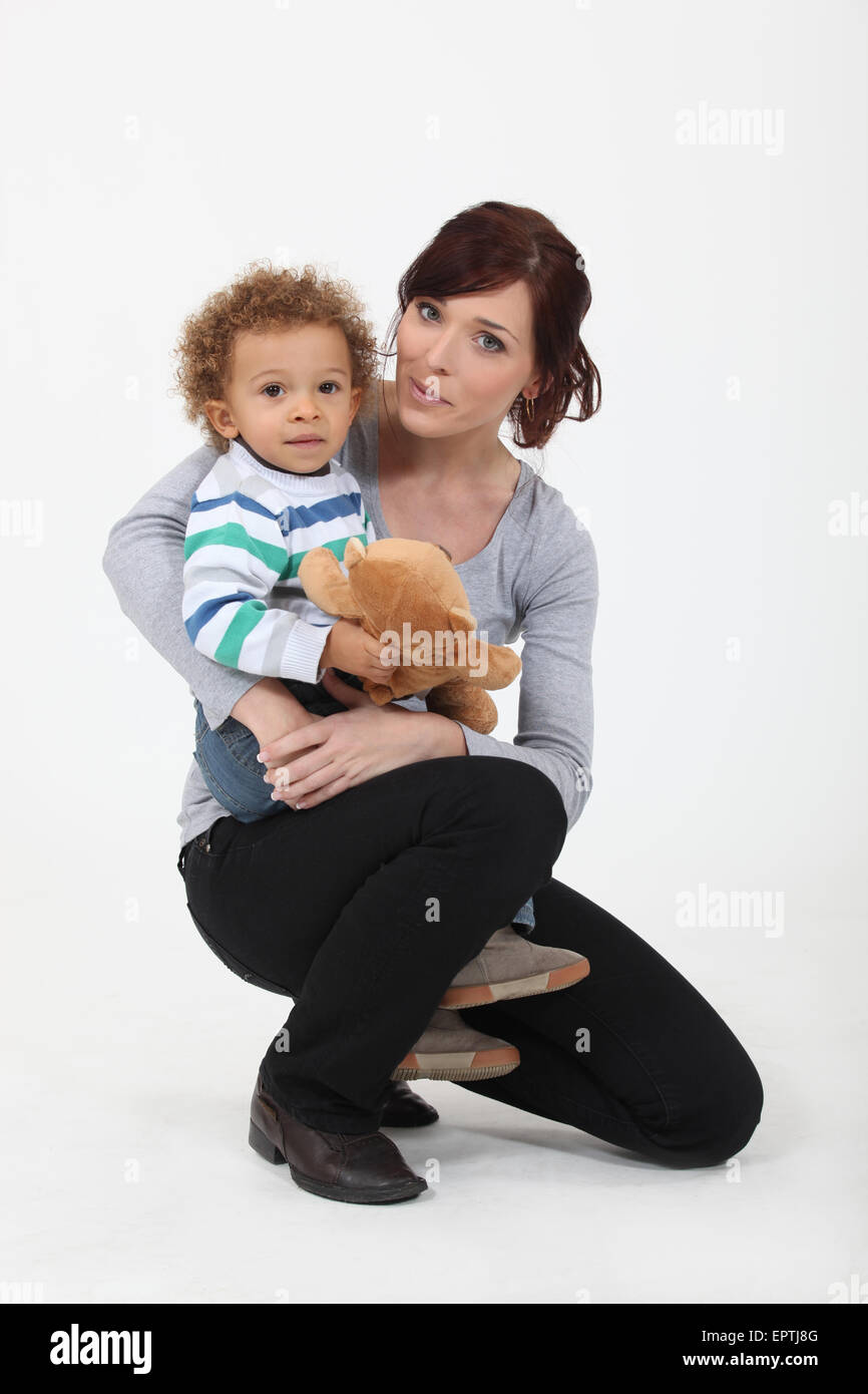 Mother and son with teddy bear Stock Photo - Alamy