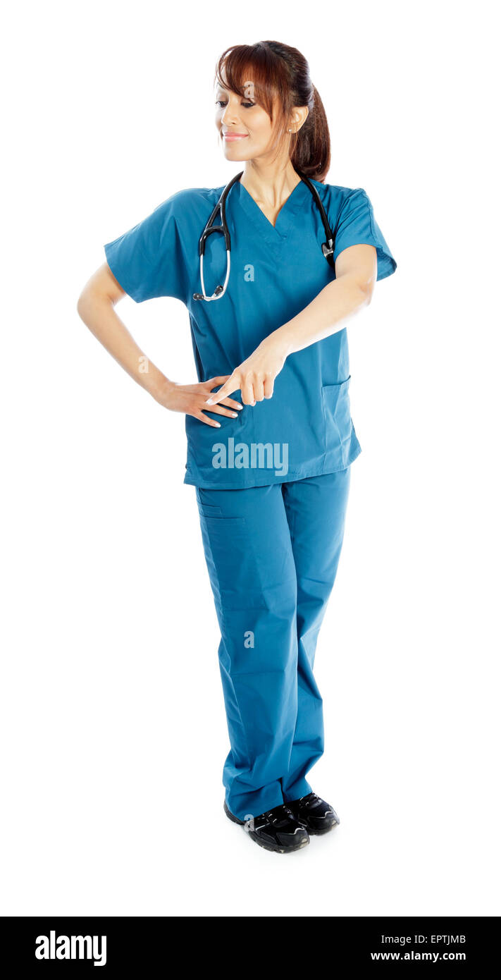 Attractive Indian doctor woman posing in a studio in front of a ...