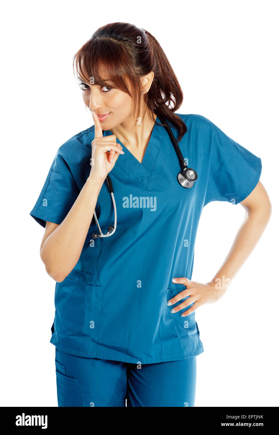 Attractive Indian doctor woman posing in a studio in front of a ...
