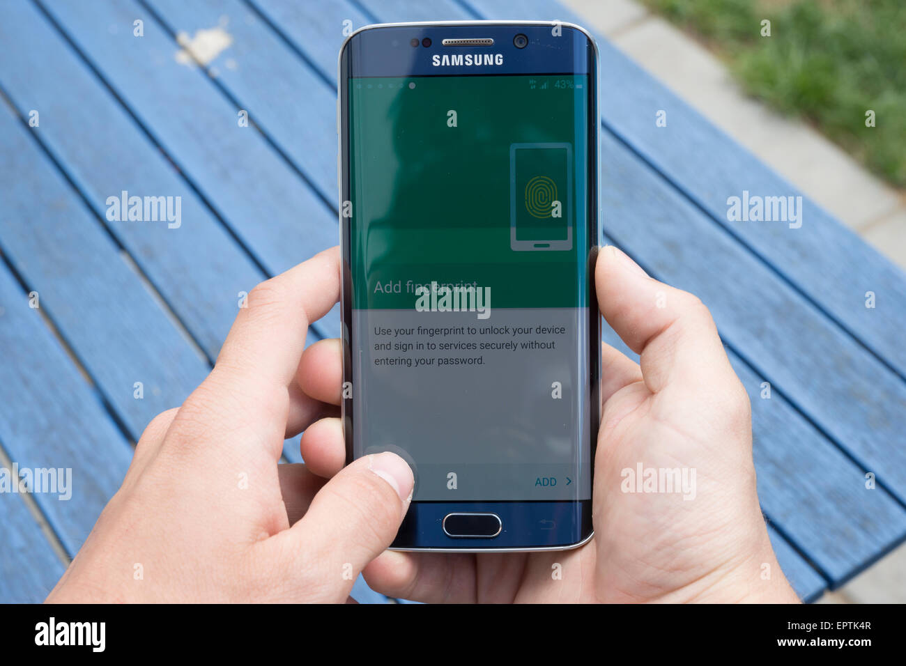 Samsung S6 edge using phone completing final stage setup asking for personal information fingerprint credit information and use Stock Photo