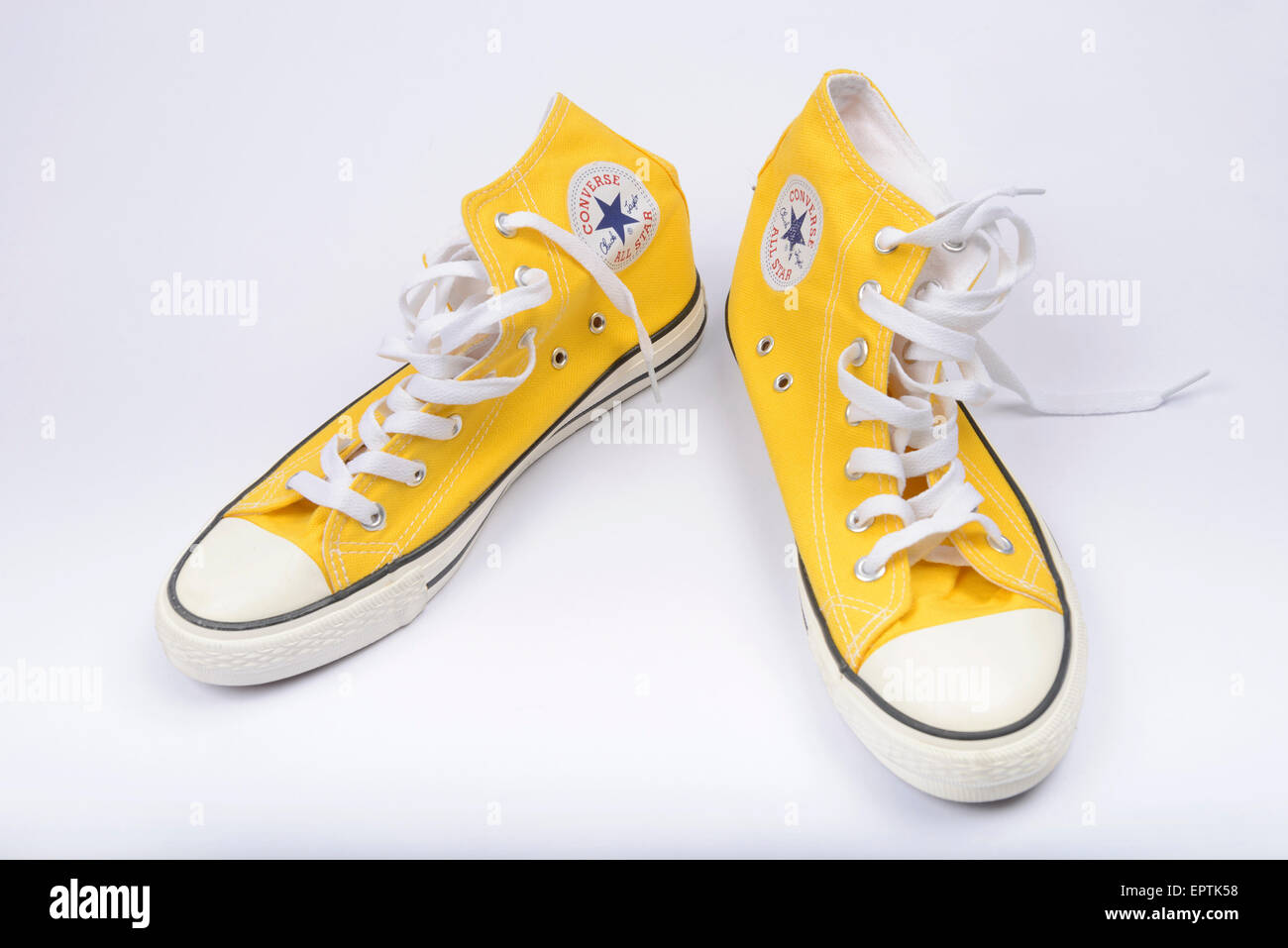 Yellow Converse Chuck Taylor All Star shoe pair Stock Photo