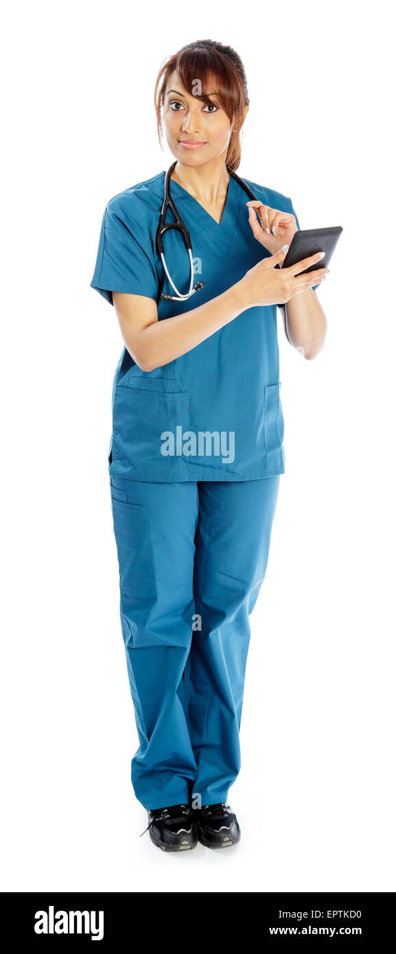 Attractive Indian doctor woman posing in a studio in front of a ...