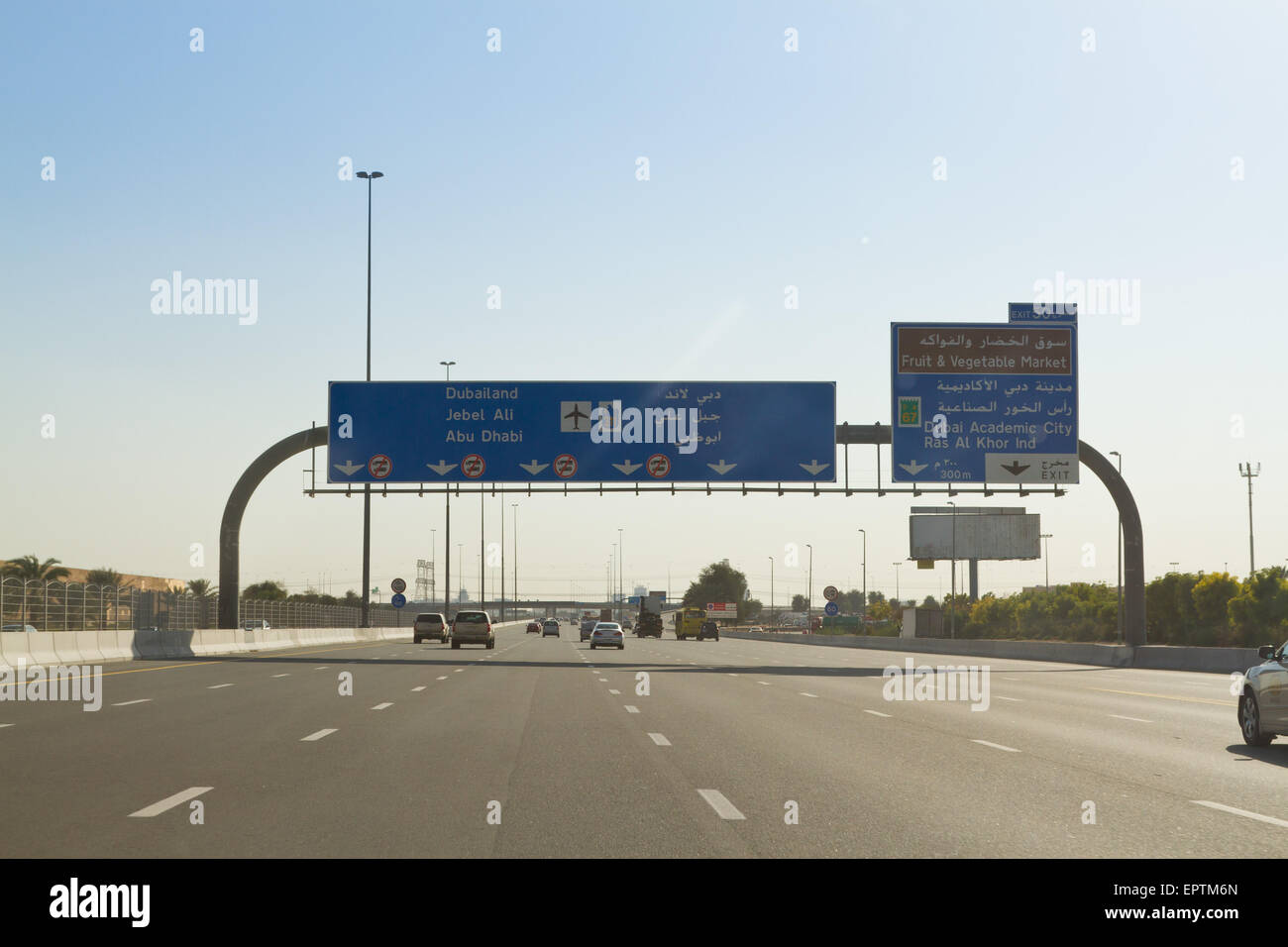 Road signs and traffic on Sheikh Mohammed Bin Zayed Road E311, Dubai, United Arab Emirates Stock Photo