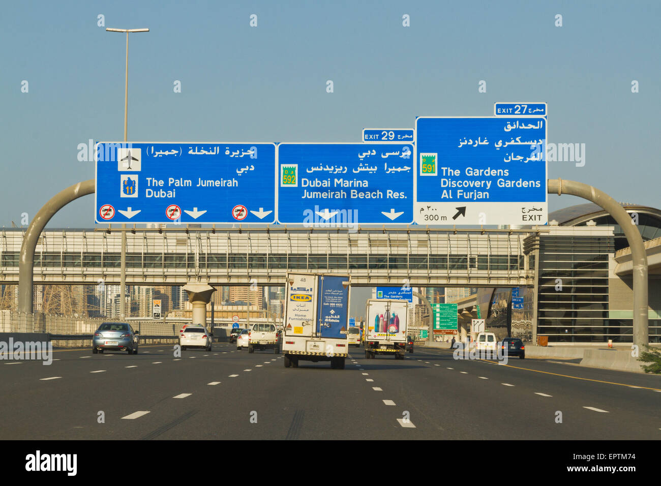 Road signs and traffic on Sheikh Zayed Road, Dubai, United Arab Emirates Stock Photo