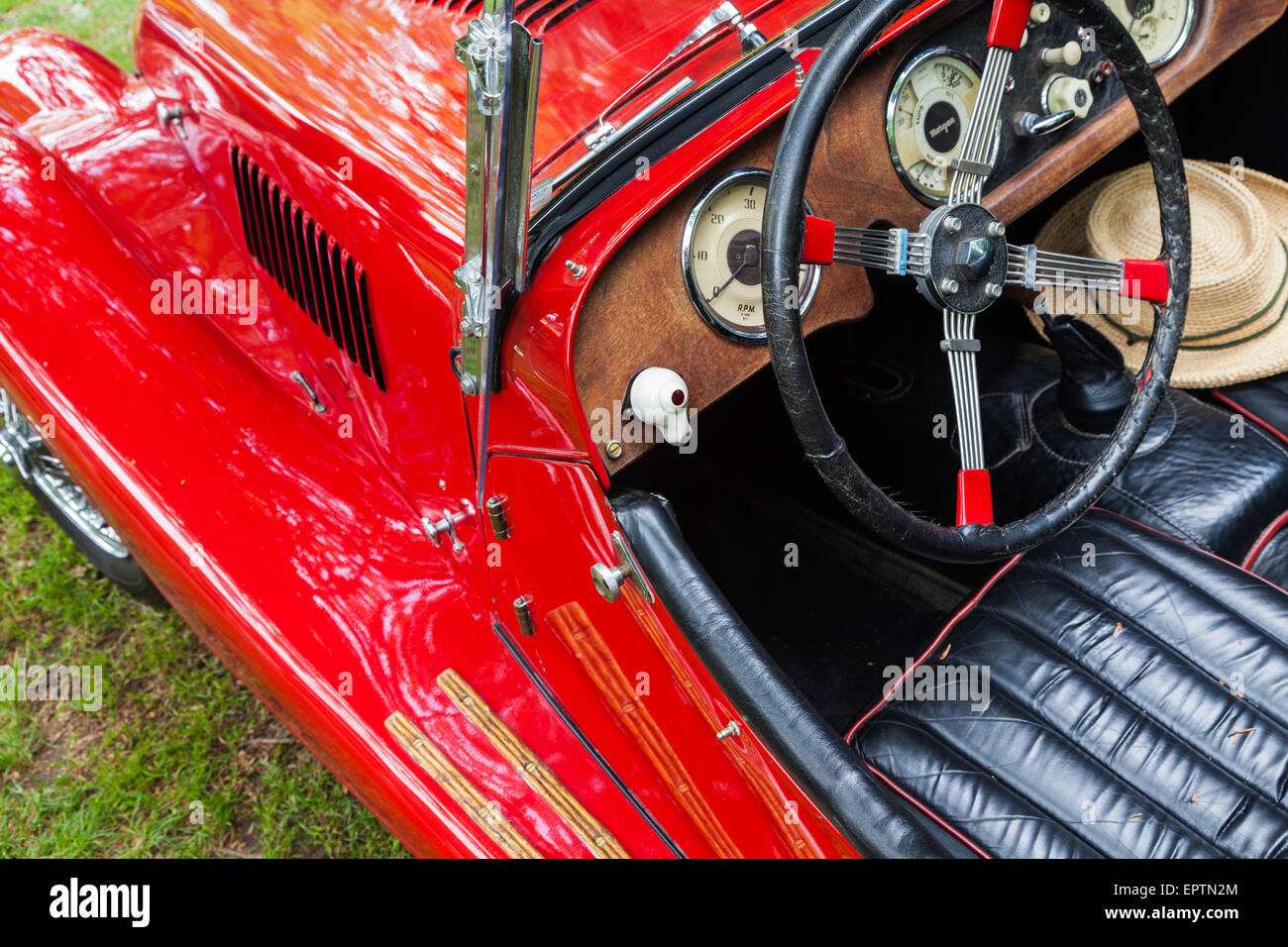 Pedestrian view of the drivers seat of an antigue 4 British