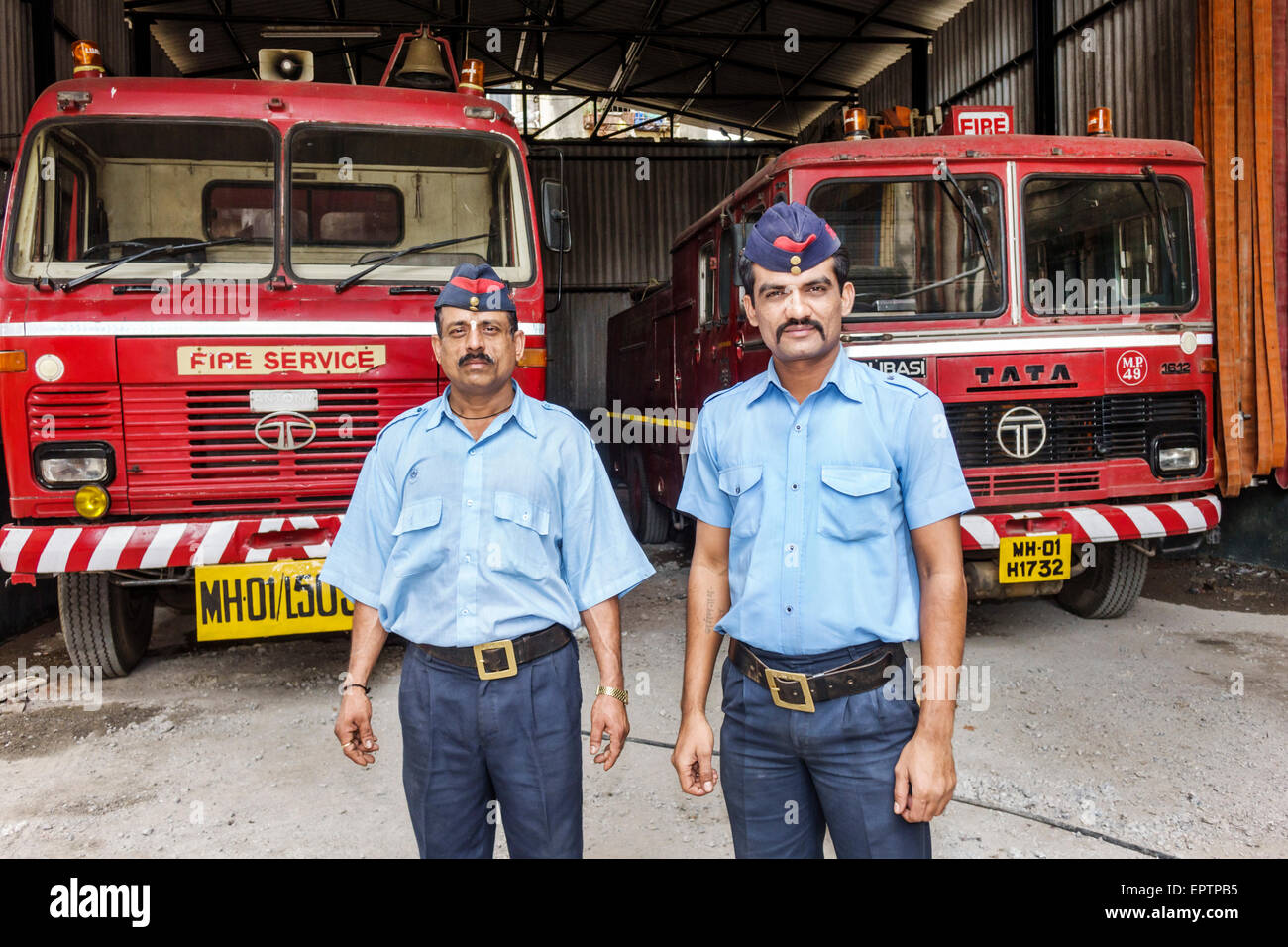 Mumbai India,Dharavi,Shahu Nagar Road,slum,fire department,garage,fireman,firemen,uniform,man men male,employee worker workers working staff,Tata,vehi Stock Photo