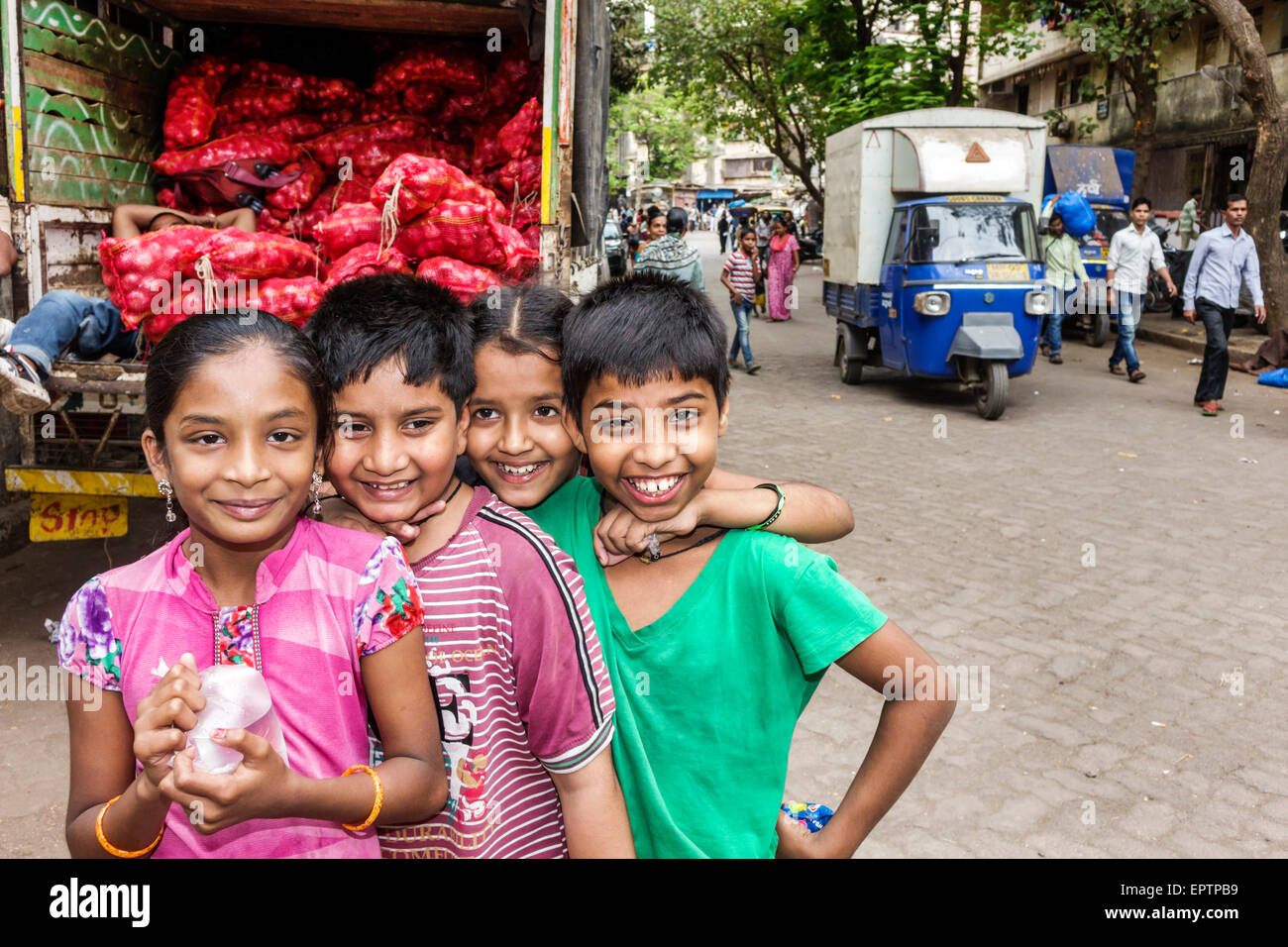 Mumbai India,Dharavi,Shahu Nagar Road,slum,girl girls,youngster,female kids children male boy boys,friends,posing,India150228039 Stock Photo