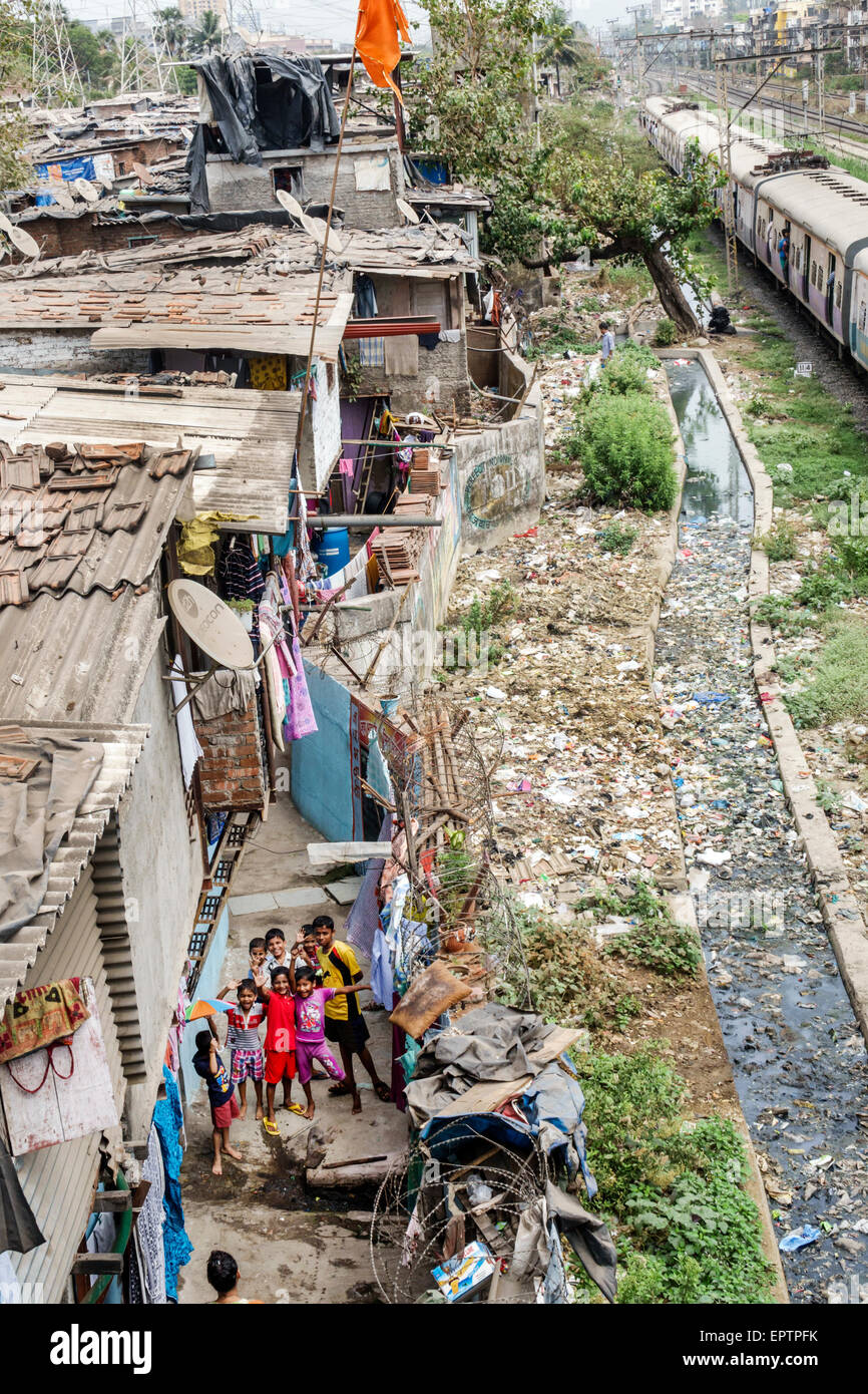 Mumbai India,Dharavi,Kumbhar Wada,slum,shanties,high population density,poverty,low income,poor,residents,male boy boys kids children friends,India150 Stock Photo