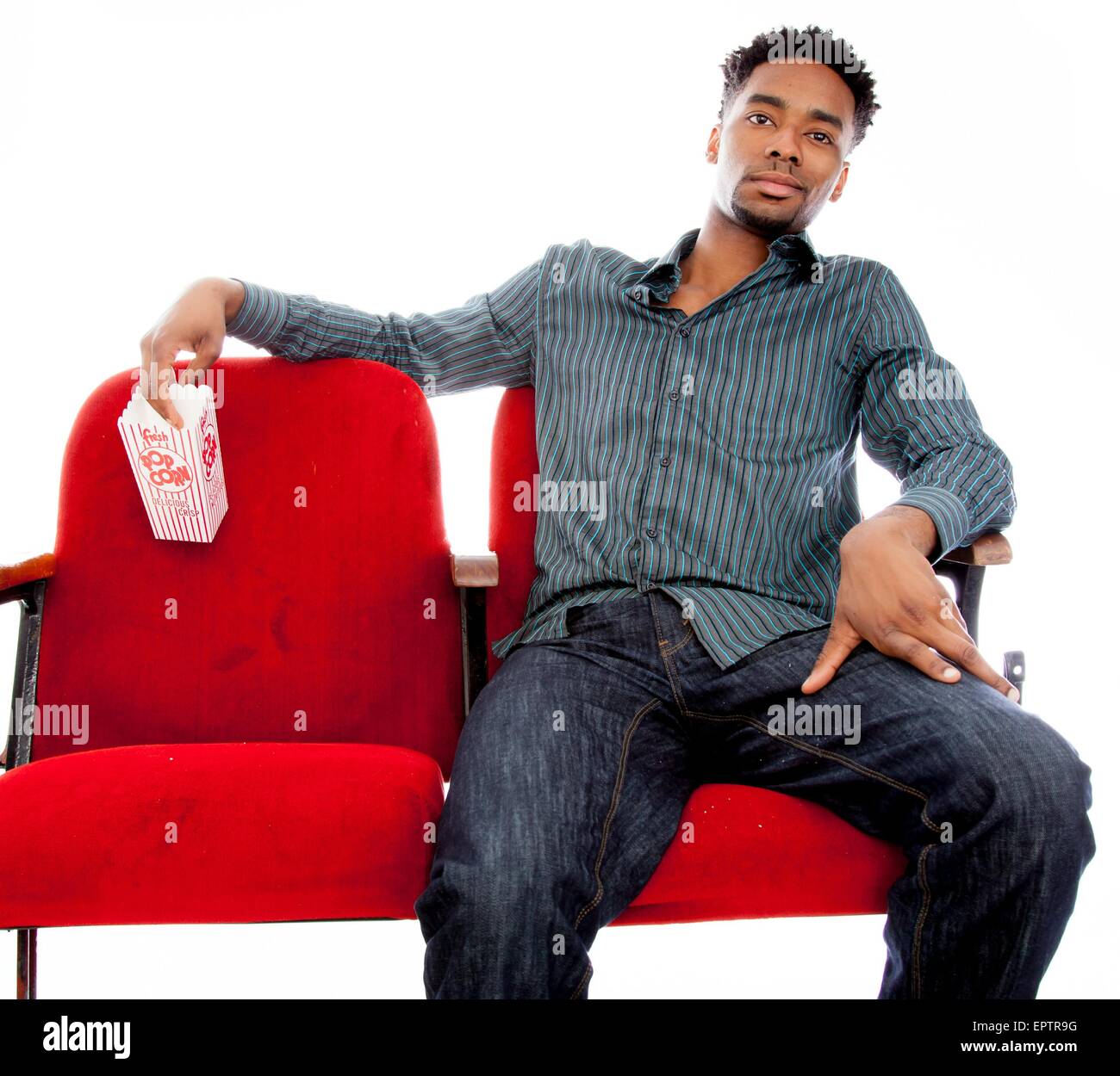 Attractive afro-american man posing in a  studio isolated on a background Stock Photo