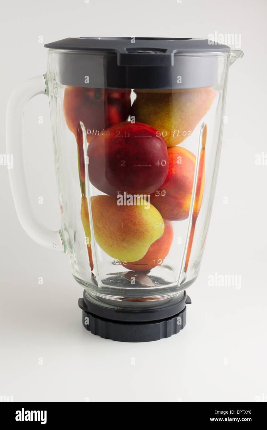 Putting Ice Cubes And Mixed Fruit Along With Pineapple Juice Into Blender  For Fruit Smoothie Free Stock Video Footage Download Clips