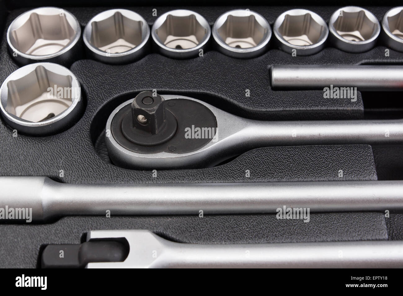 set of metal automobile tools located in individual cells Stock Photo