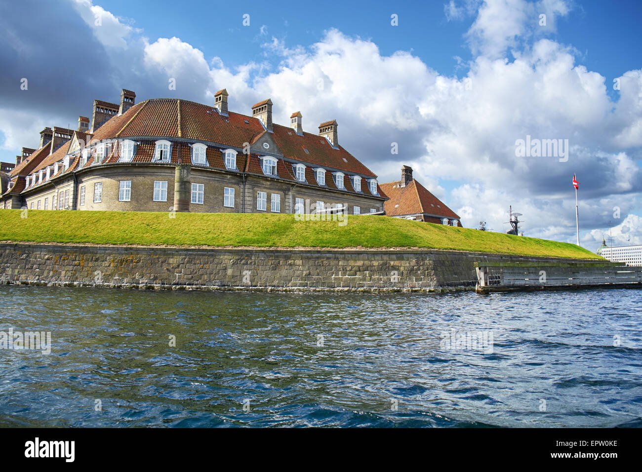 The red roof house. The viev from the channel Holmen. Copenhagen. Denmark. Stock Photo