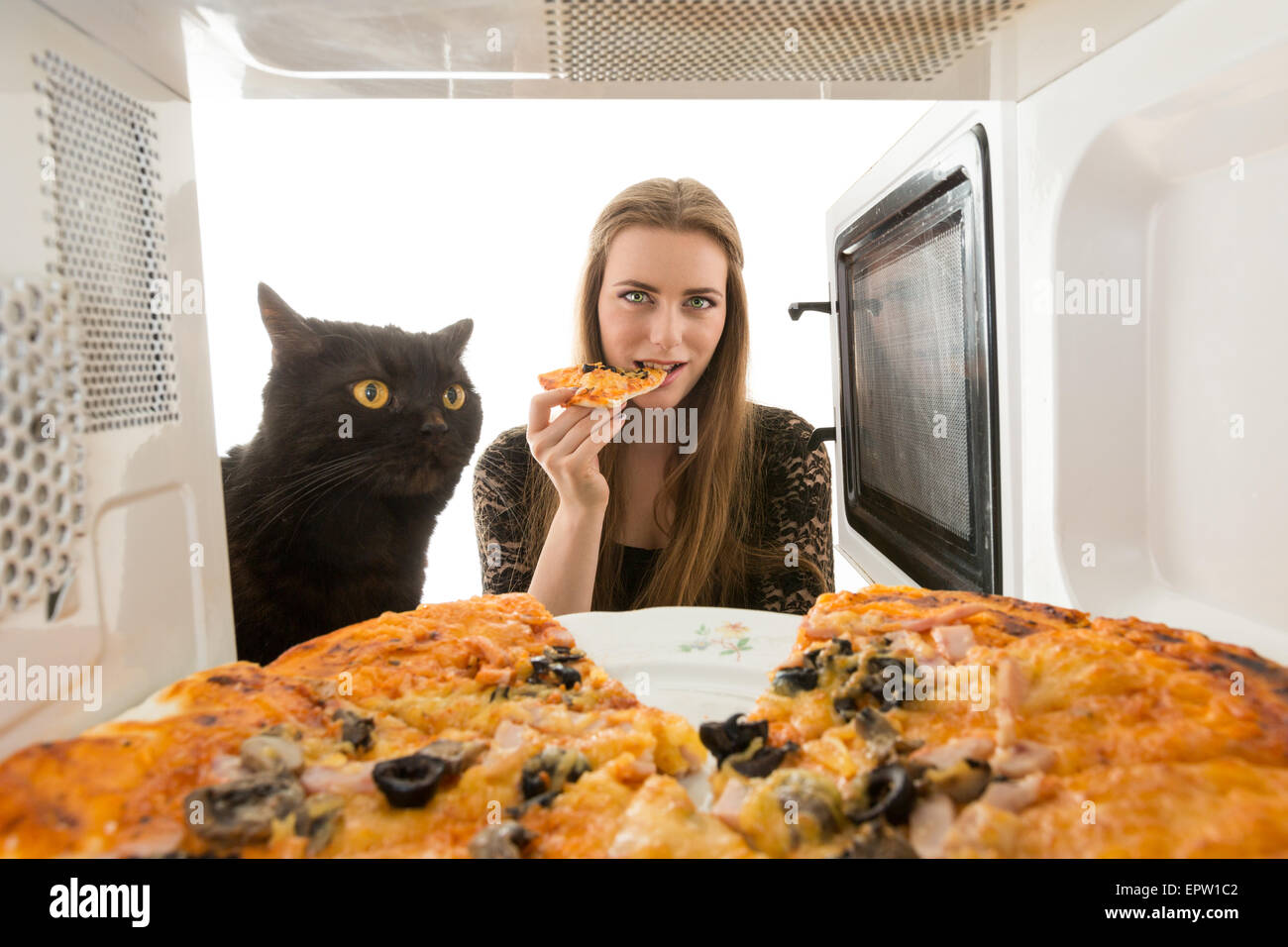 The girl and a cat cook pizza Stock Photo Alamy