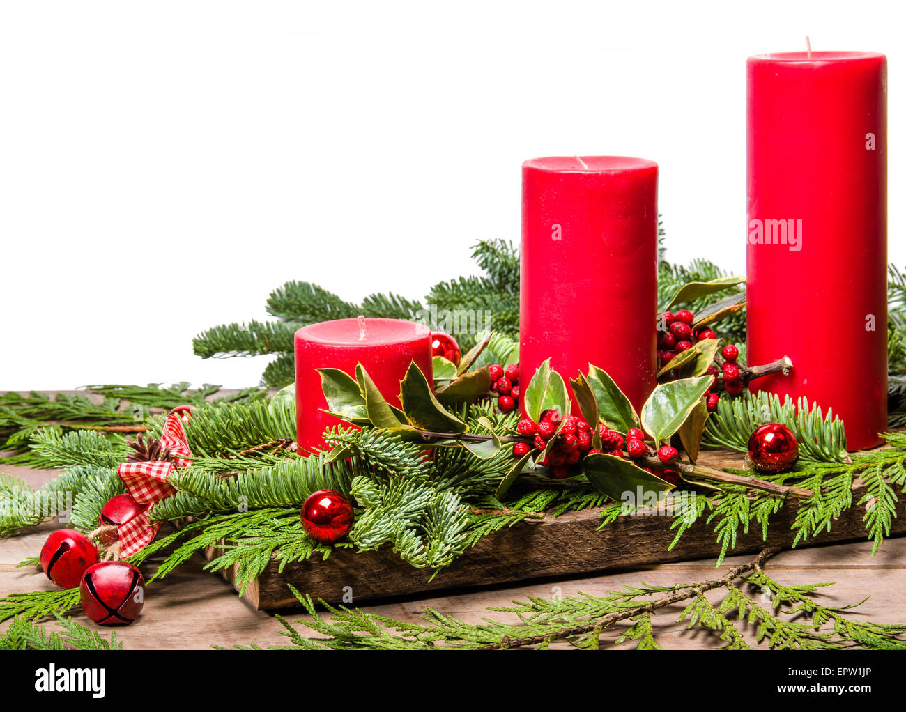 Group of red Christmas candles with a white background and ribbon Stock Photo