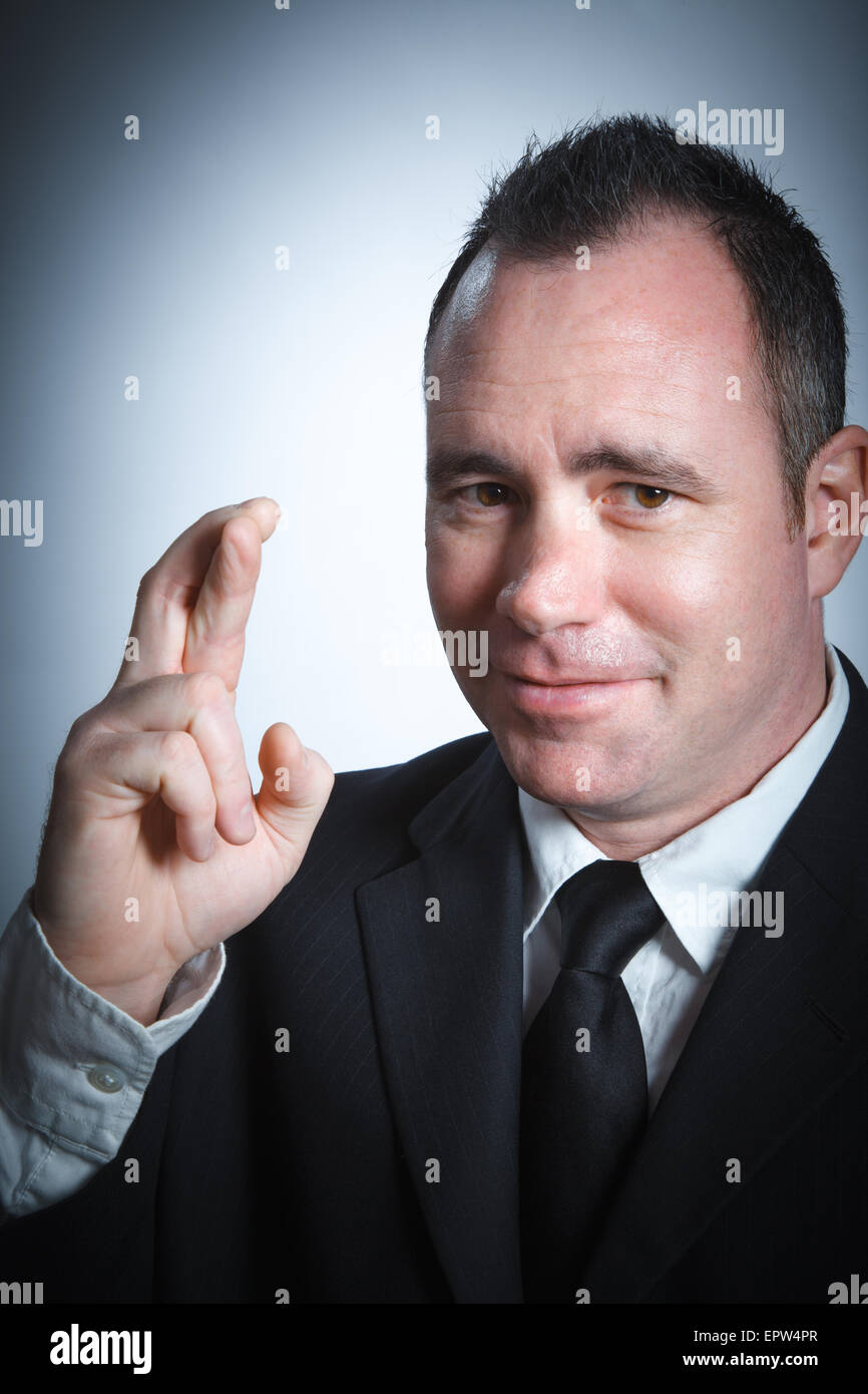 Caucasian businessman 40 years old isolated on a grey background Stock Photo