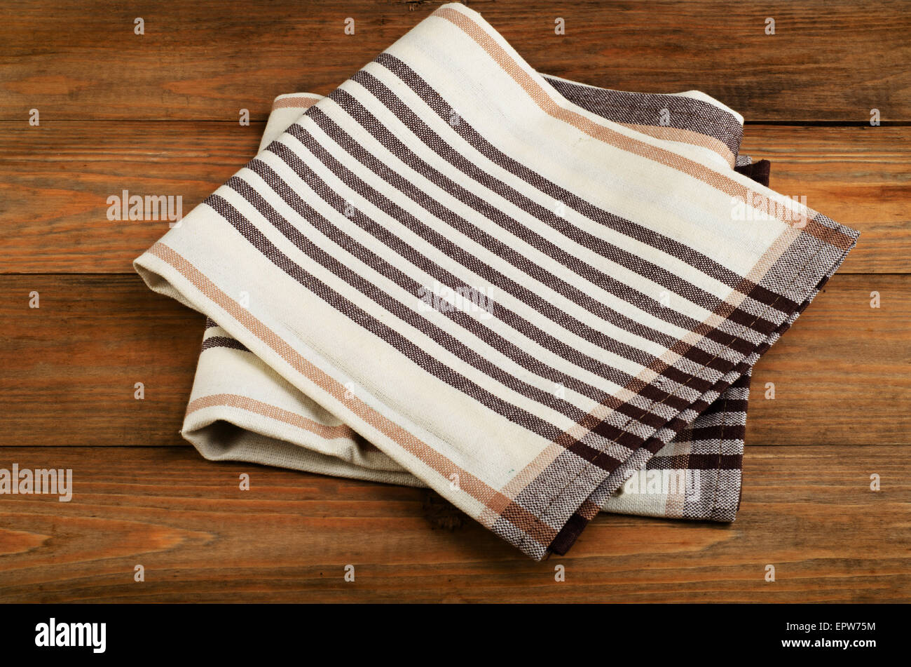 Tablecloth textile on  old wooden  background. Stock Photo
