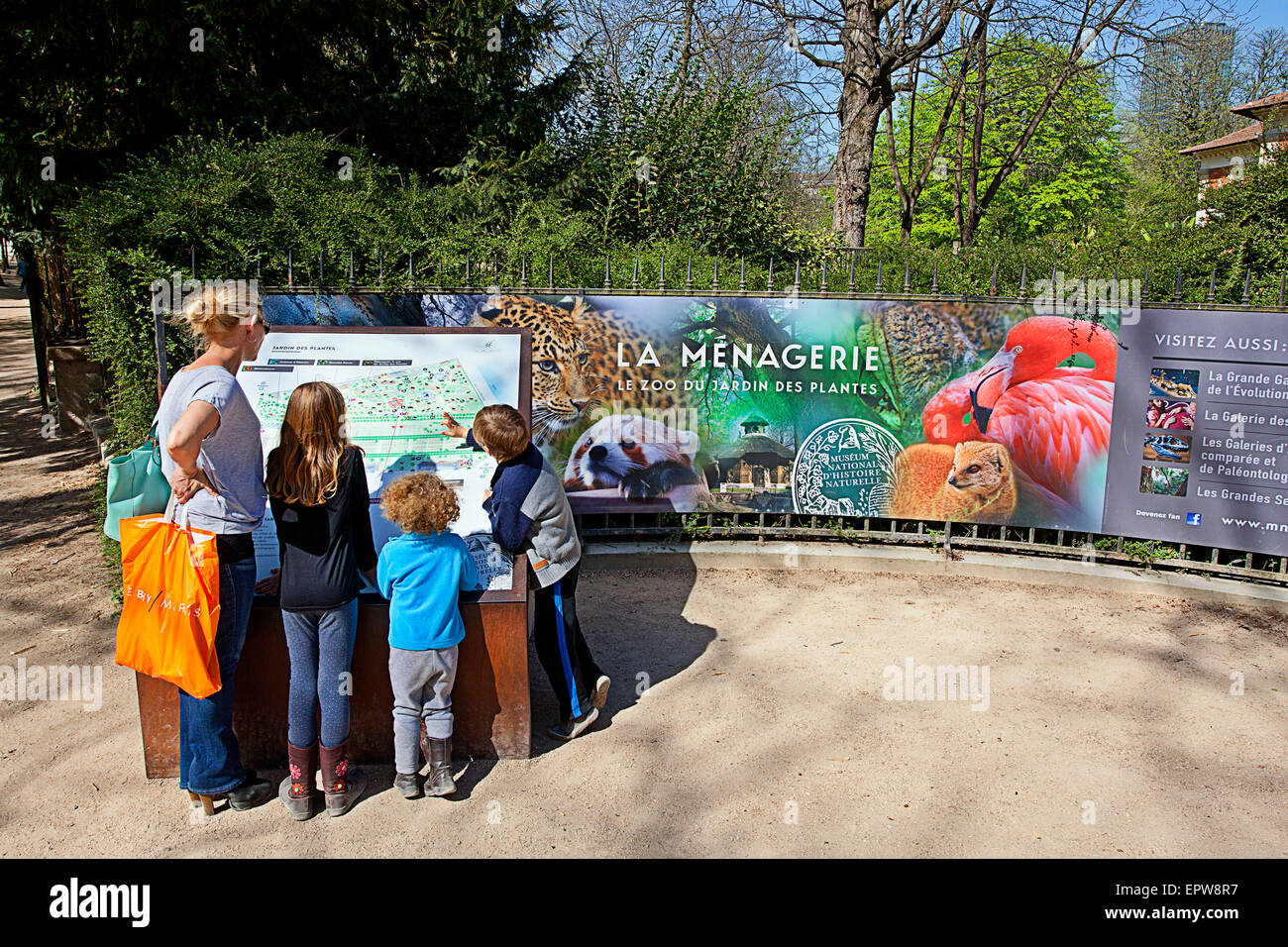 Visitors at the Paris Zoo looking at the zoo map Stock Photo