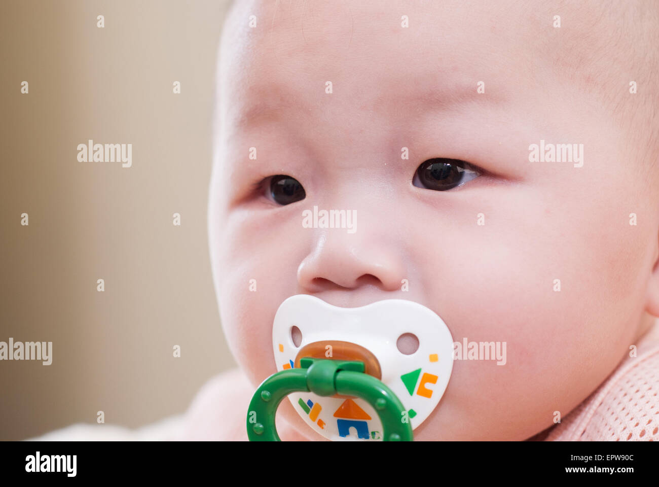 asian baby with a pacifier Stock Photo Alamy