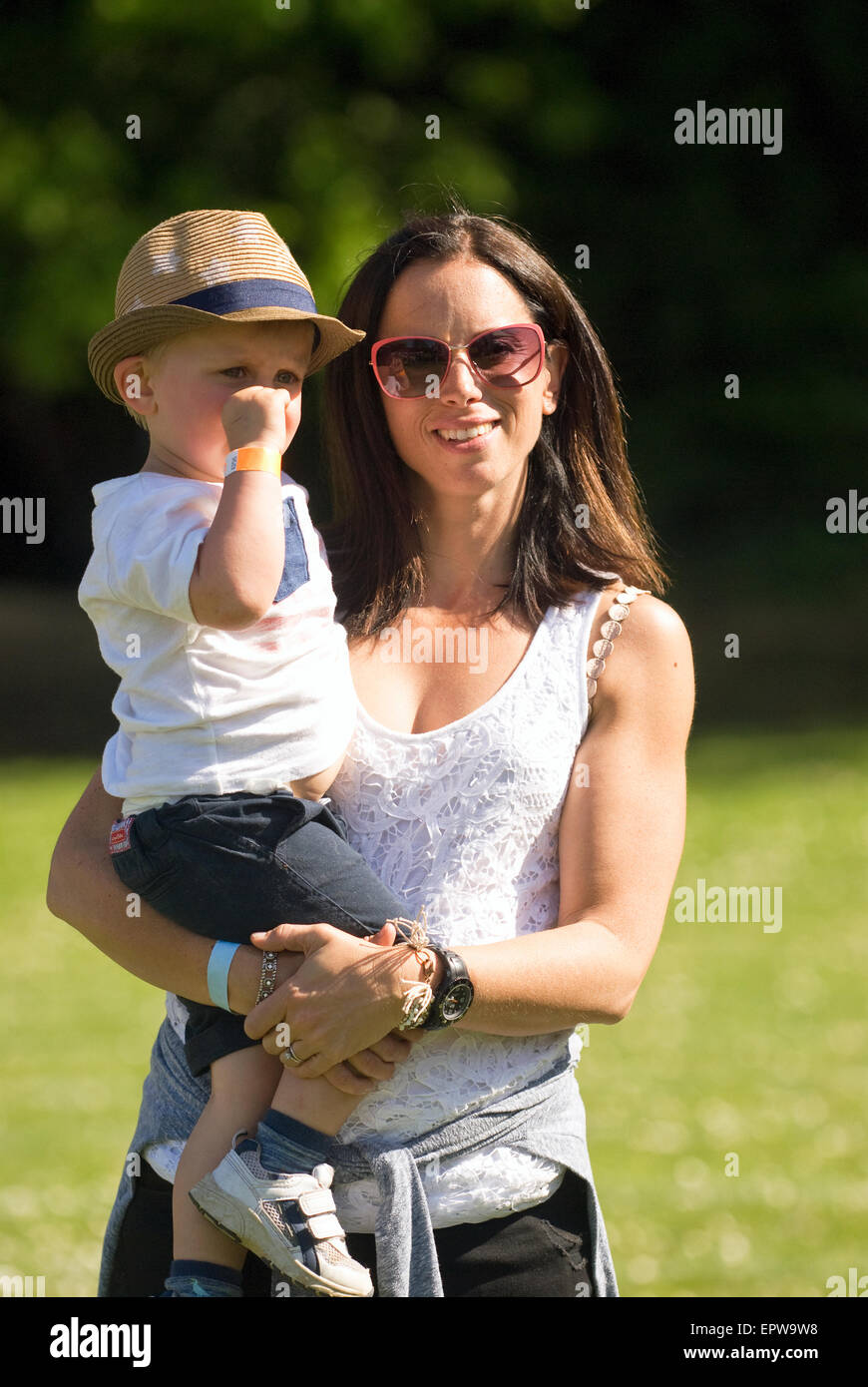 Mother and child enjoying themselves at a local music festival (CHIDDFEST 2015), Chiddingfold, Godalming, Surrey, UK. Stock Photo