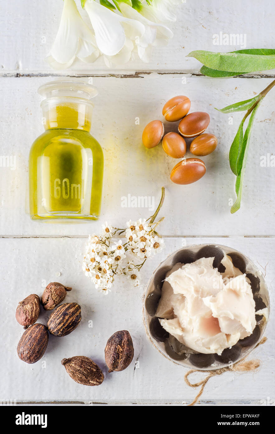 Argan fruits and oil, whit shea nuts and butter Stock Photo Alamy